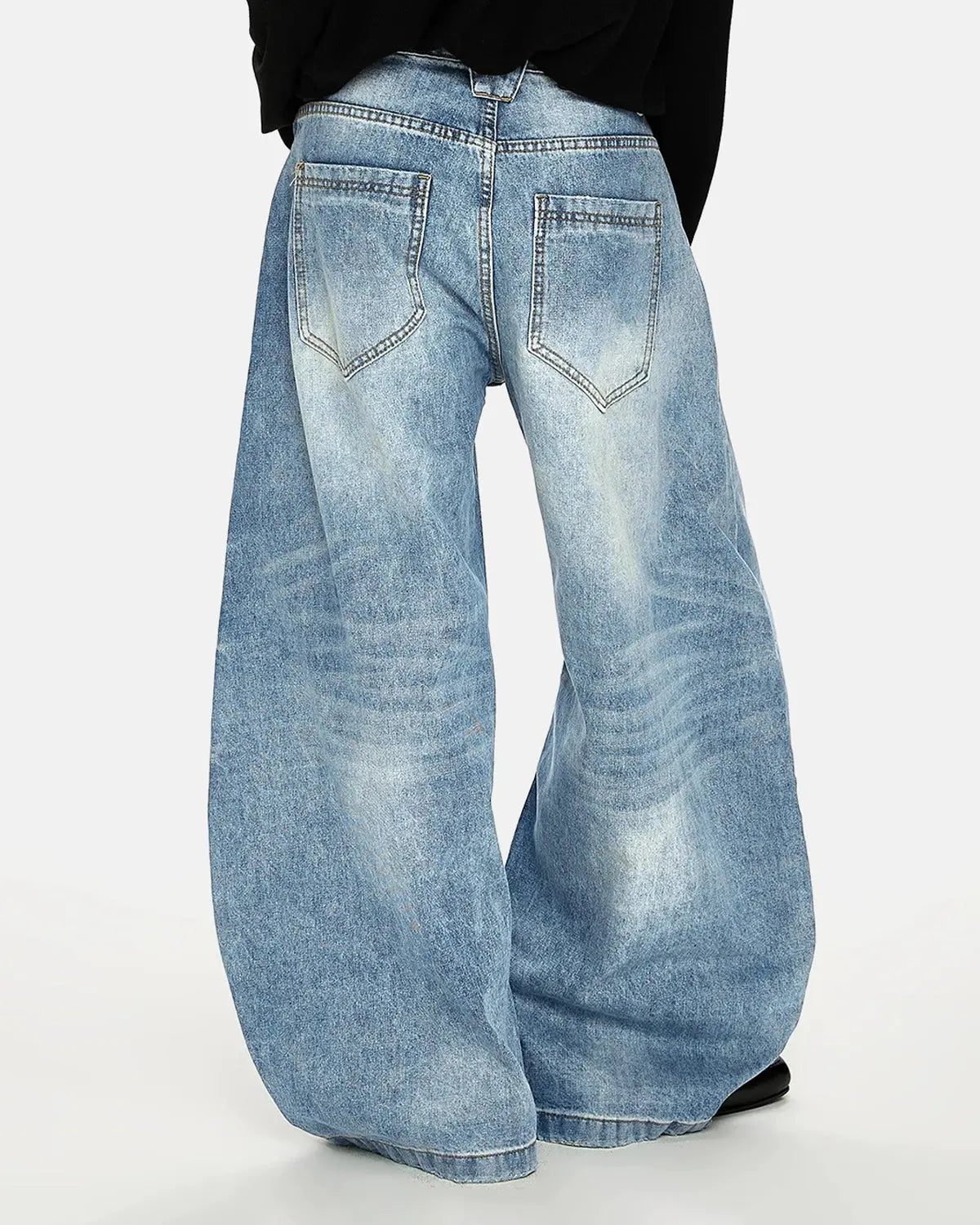 Blue acid-washed Flation whisker clasp barrel jeans, stylish streetwear pants with a relaxed fit and vintage-inspired design.