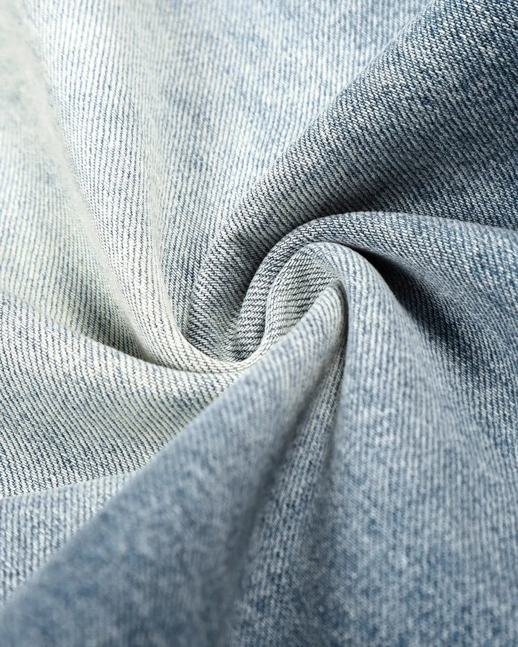 Blue acid-washed Whisker Clasp Barrel Jeans by Flation Streetwear, showcasing relaxed fit and distressed denim design.