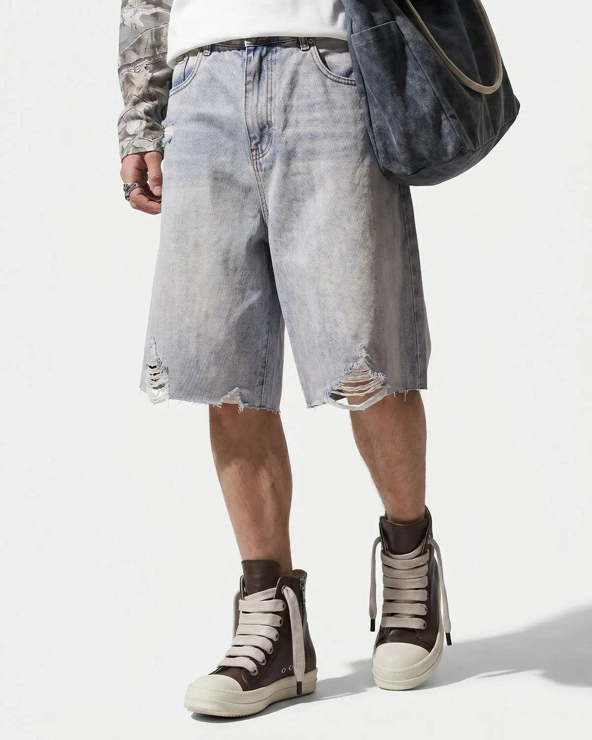 Blue Flation streetwear pants with adjustable waist and baggy fit, designed as stylish jorts for a casual look.
