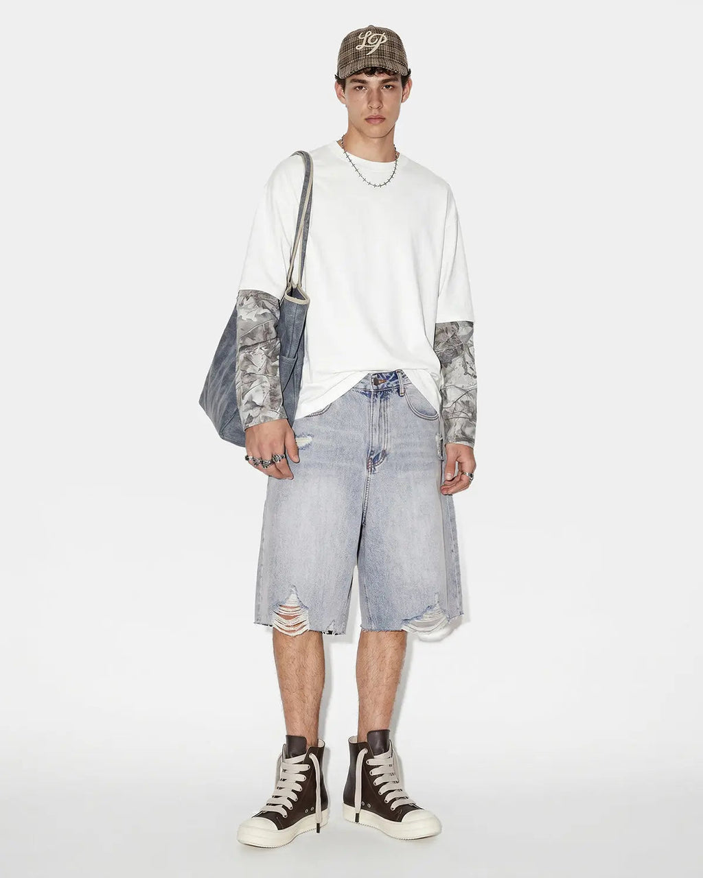 Blue adjustable waist baggy jorts by Flation Streetwear, relaxed fit denim pants with adjustable waistband and casual style.