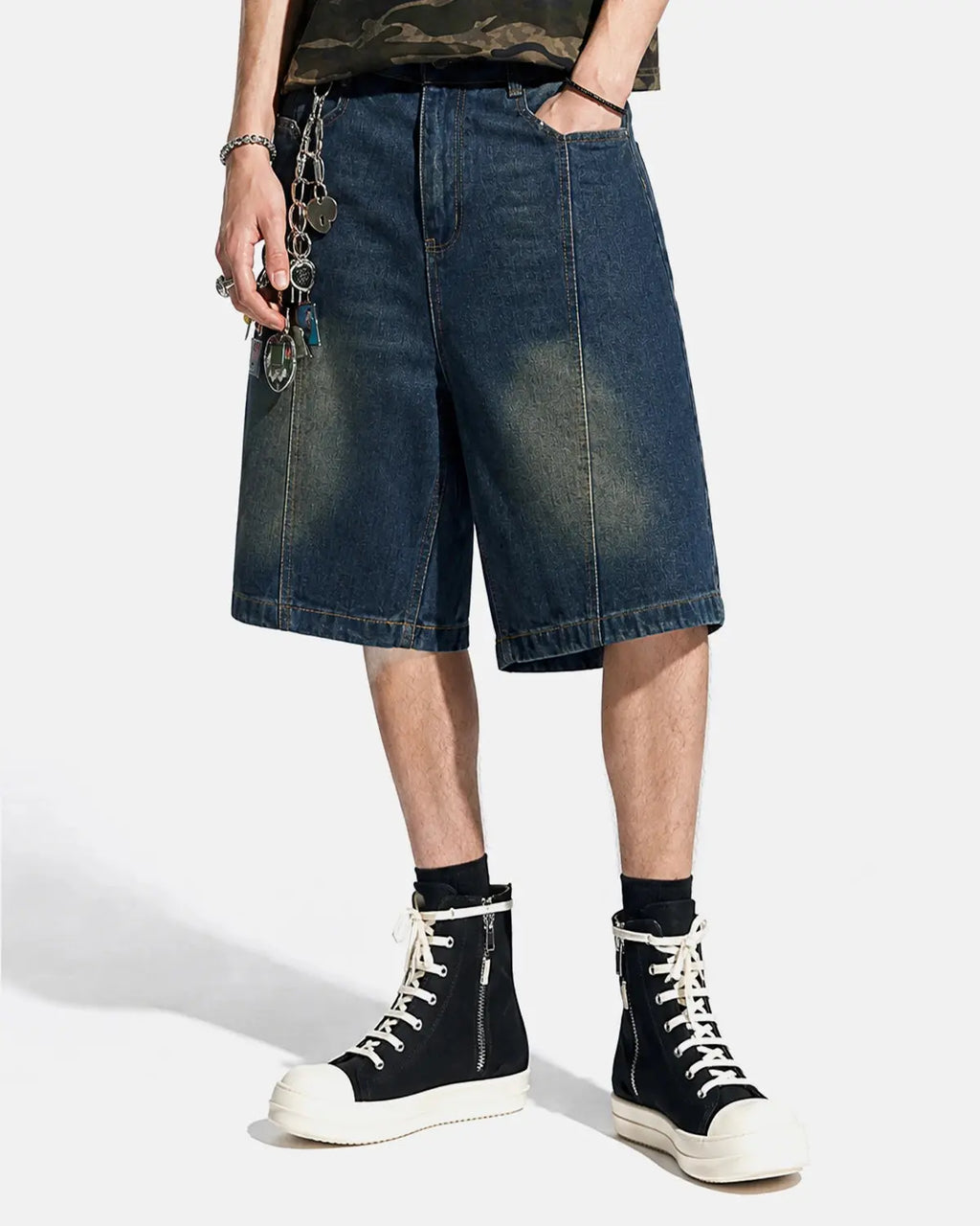 Blue deconstructed washed denim jorts by Flation, streetwear pants with frayed edges and distressed details, casual and stylish.