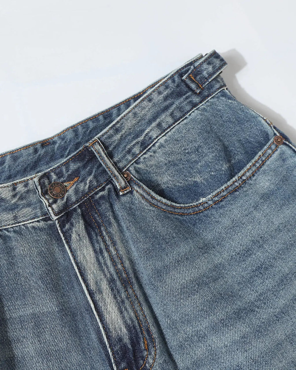 Blue distressed baggy jorts by Flation with adjustable waist tabs, casual streetwear pants for a relaxed, trendy look.