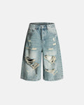 Blue distressed longline jorts by Flation Streetwear, casual denim pants with frayed edges and a relaxed fit.