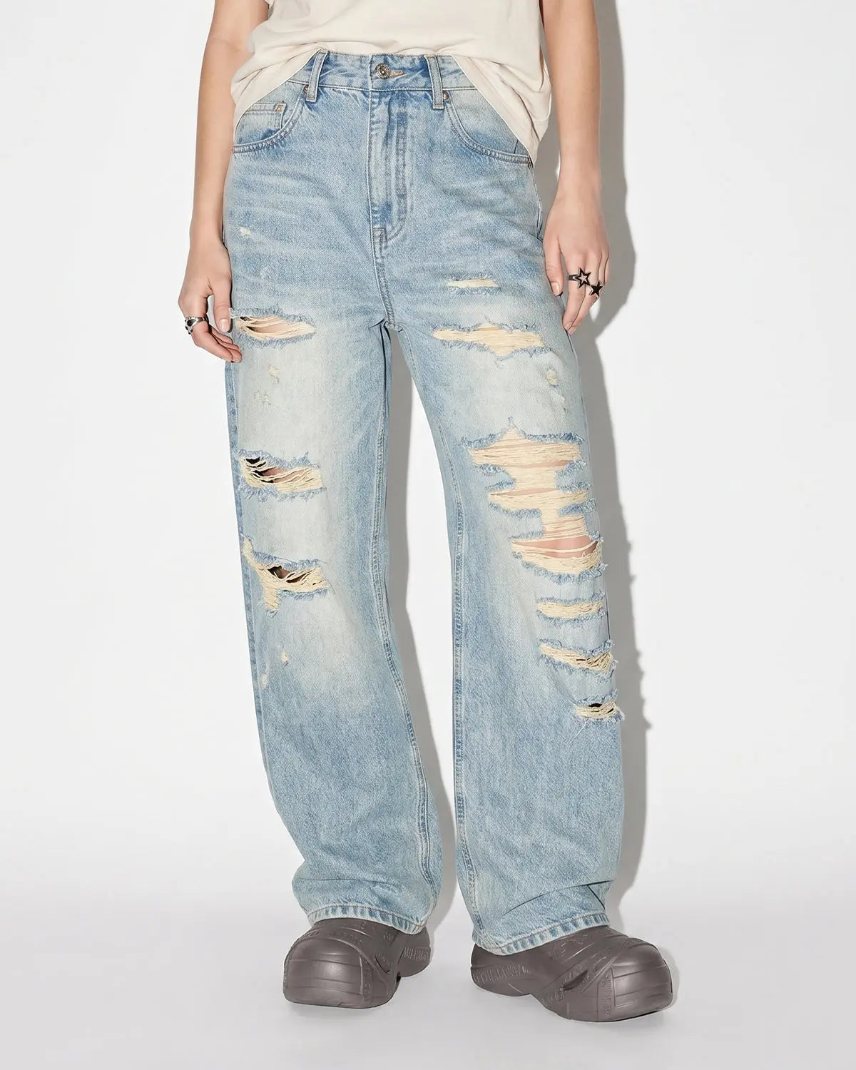 Blue distressed ripped straight-leg jeans from Flation Streetwear, showcasing a casual, worn-in denim style with frayed details.