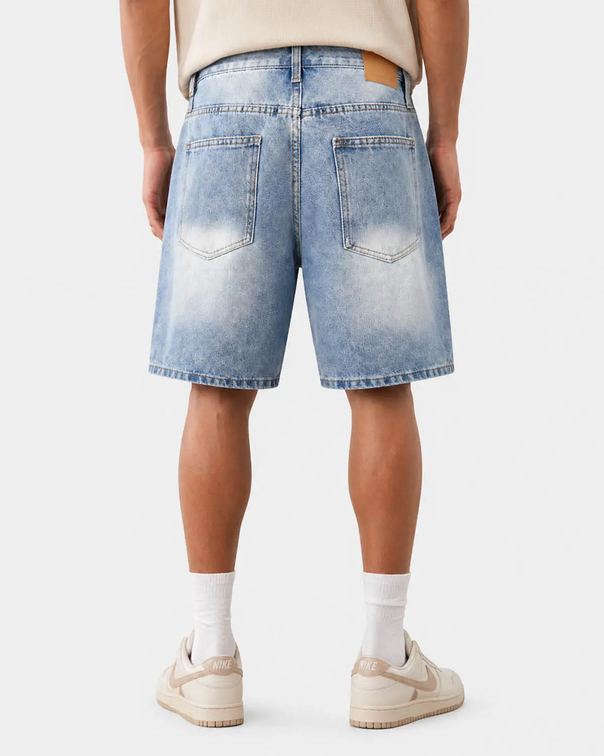 Ripped mid-length washed denim shorts from INFLATION, casual streetwear pants with distressed details and a relaxed fit.