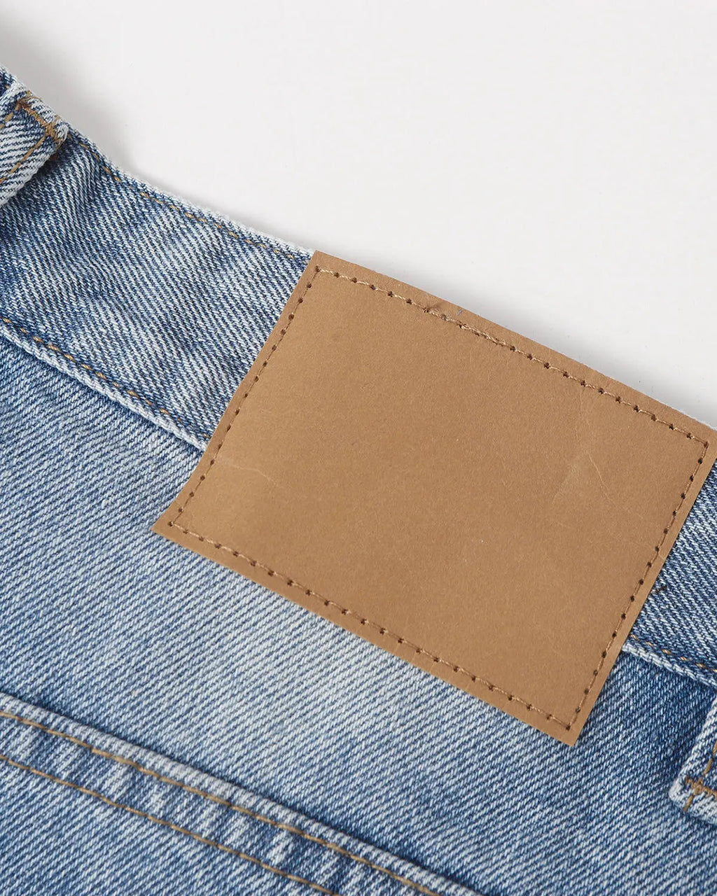 Blue Flation streetwear ripped mid-length washed denim shorts, showcasing distressed details and casual style.