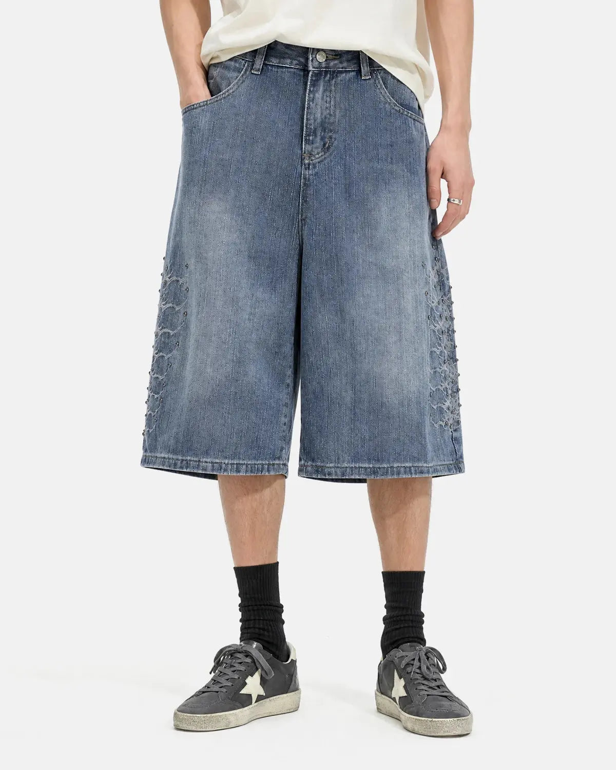 Blue studded bamboo weave jorts by Flation Streetwear, casual denim-style pants with metal stud accents.
