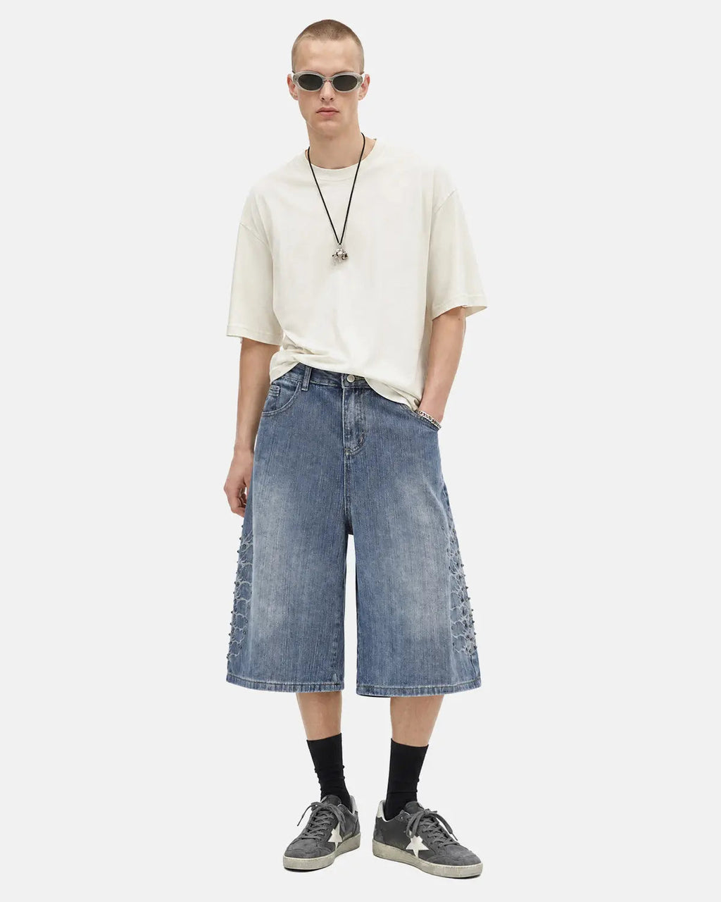 Blue studded bamboo weave jorts by Flation Streetwear, casual pants with distressed details and edgy stud accents.