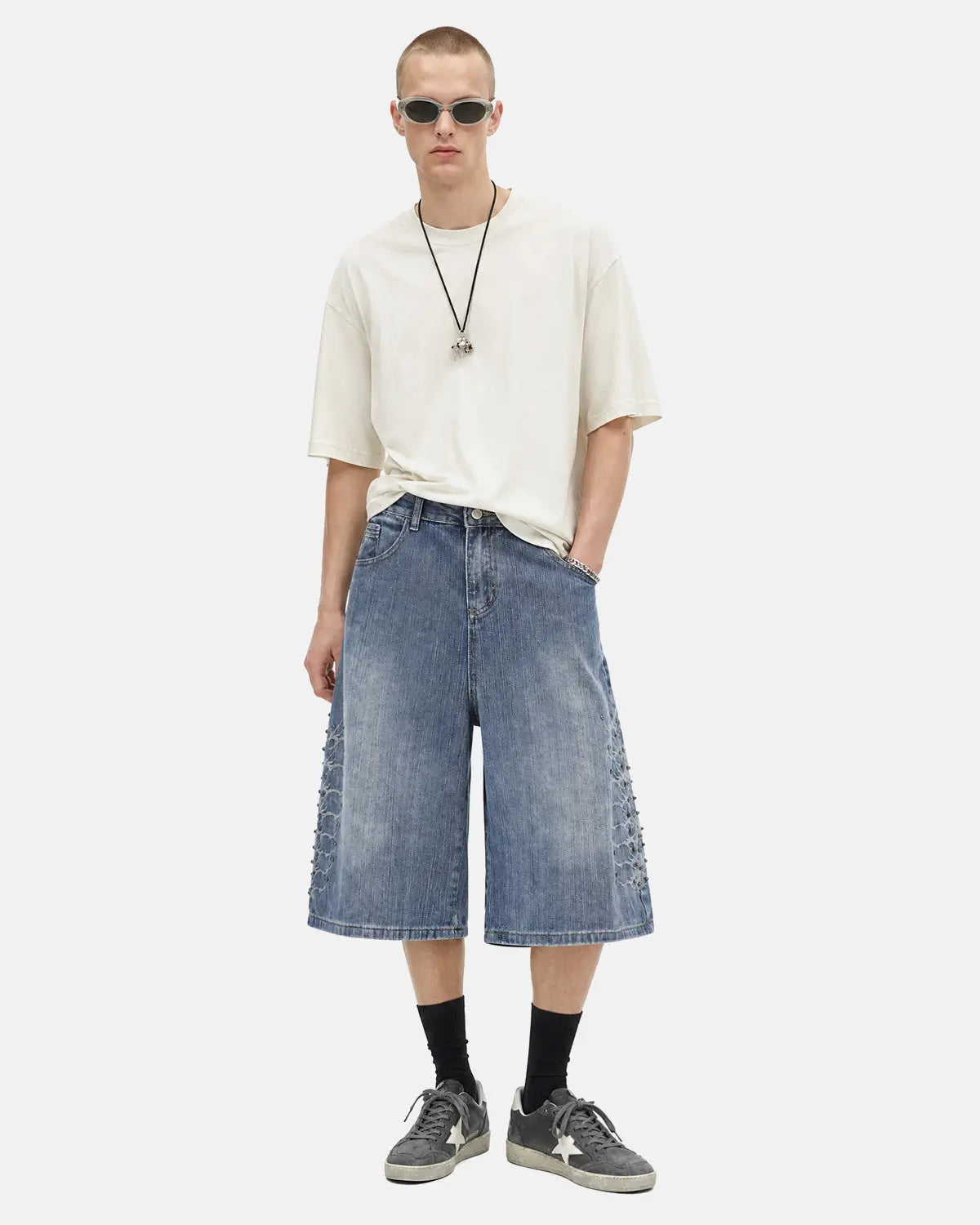 Blue studded bamboo weave jorts by Flation Streetwear, casual pants with distressed details and edgy stud accents.