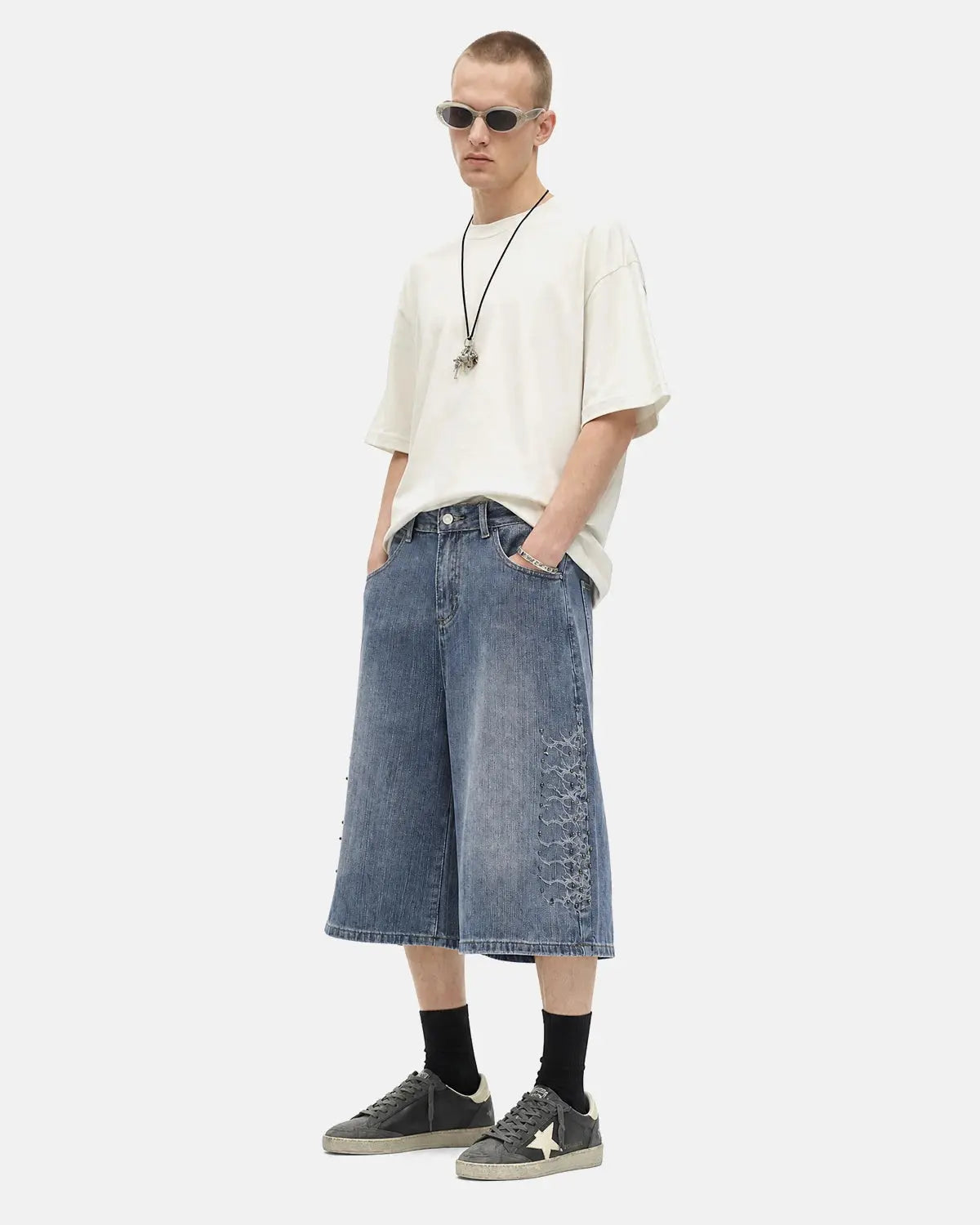 Blue Flation streetwear studded bamboo weave jorts, casual pants with metal studs and textured bamboo fabric details.