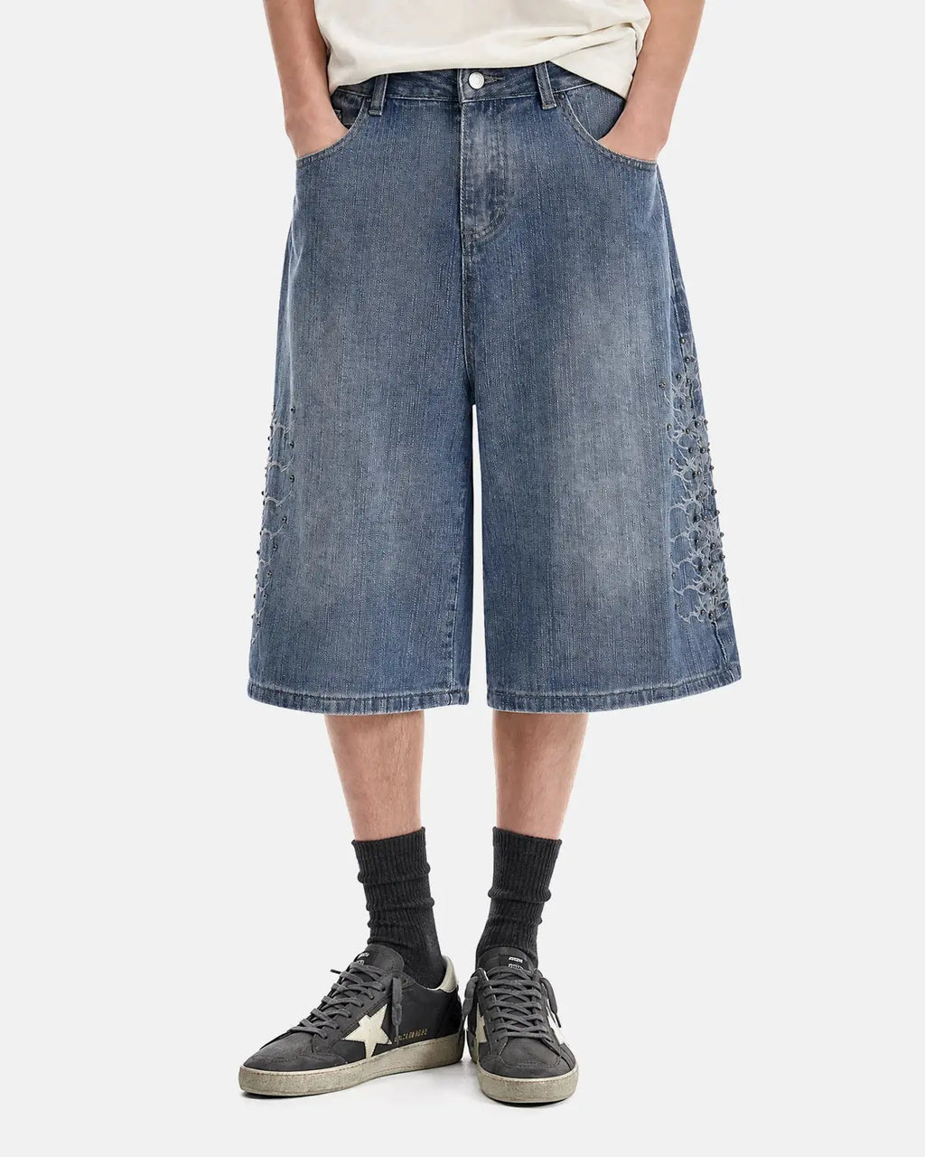 Blue studded bamboo weave jorts by Flation Streetwear, casual denim-style pants with metal stud accents