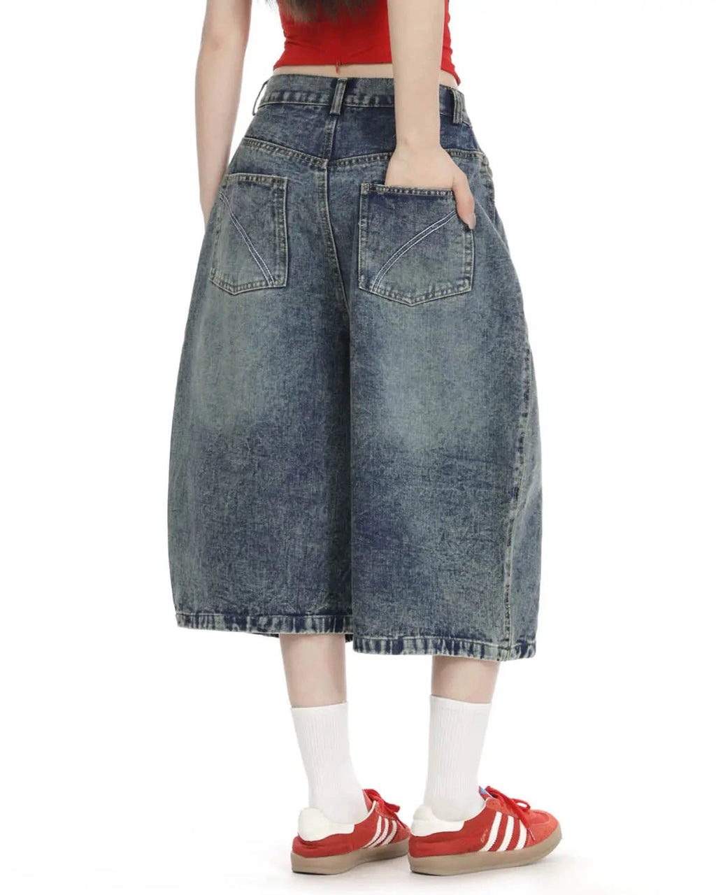 Blue washed long baggy Jorts with studded details by Flation Streetwear, showcasing a relaxed fit and distressed denim style.