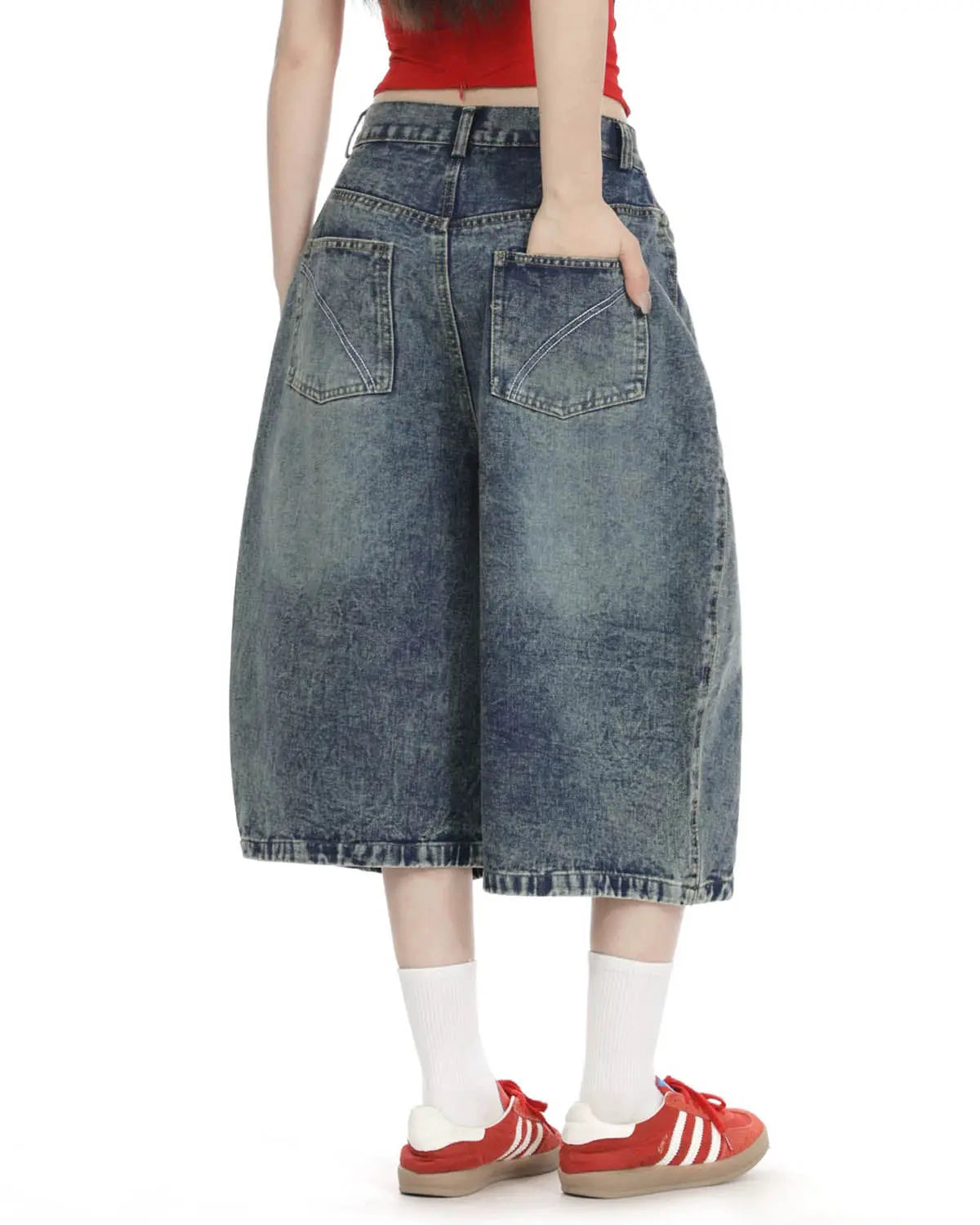 Blue washed long baggy Jorts with studded details by Flation Streetwear, showcasing a relaxed fit and distressed denim style.