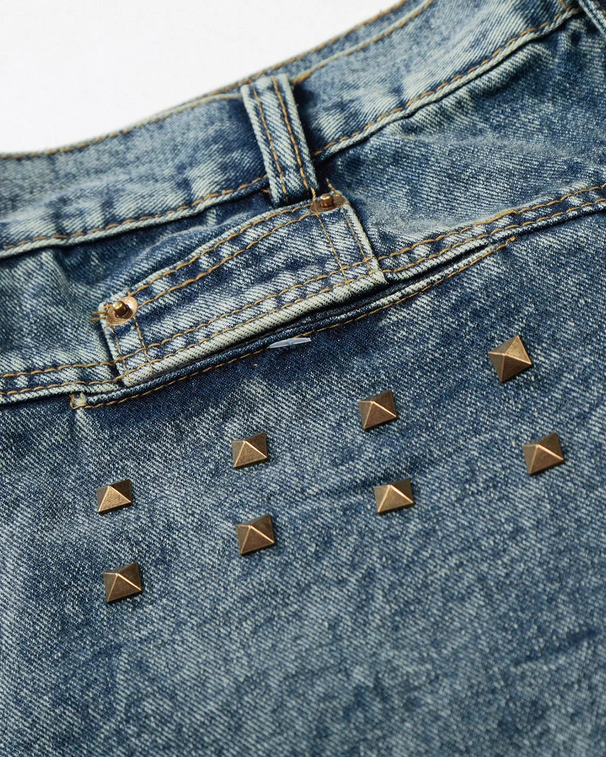 Blue studded washed long baggy jorts by Flation Streetwear, relaxed fit denim pants with metal studs and distressed details.