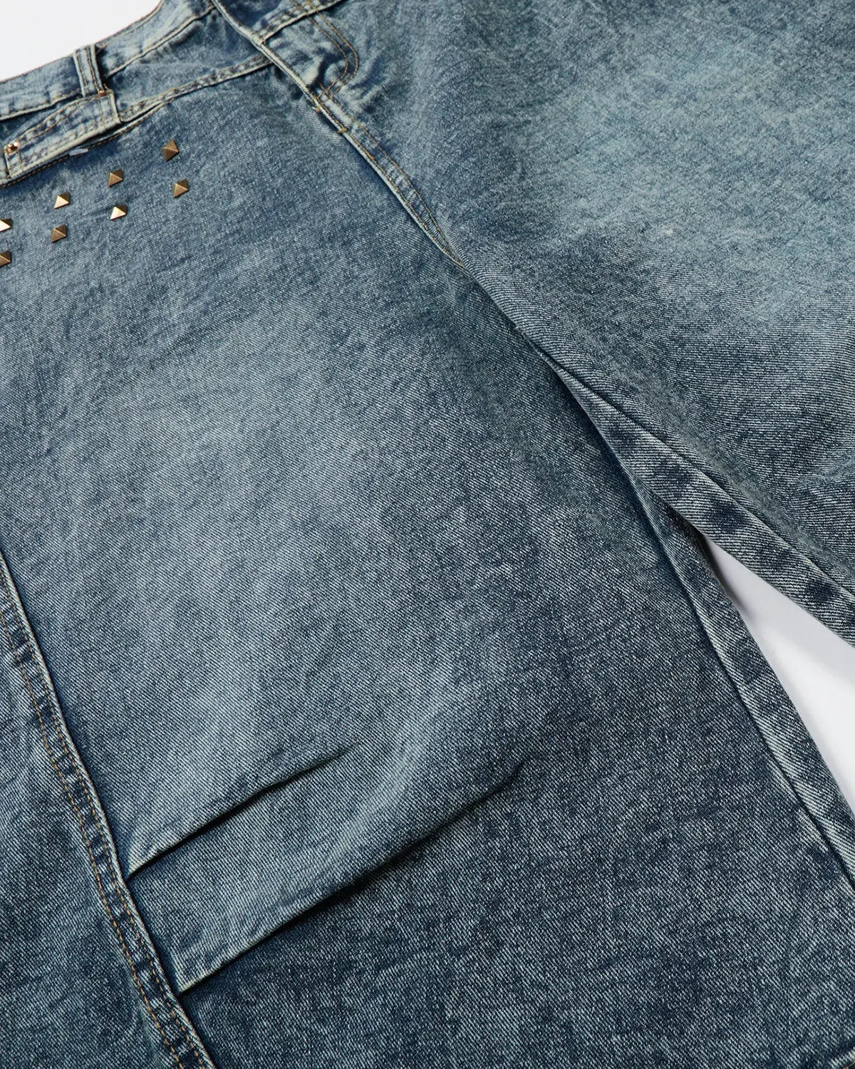 Blue washed long baggy jorts with studded details by Flation Streetwear, casual denim pants with a relaxed fit.