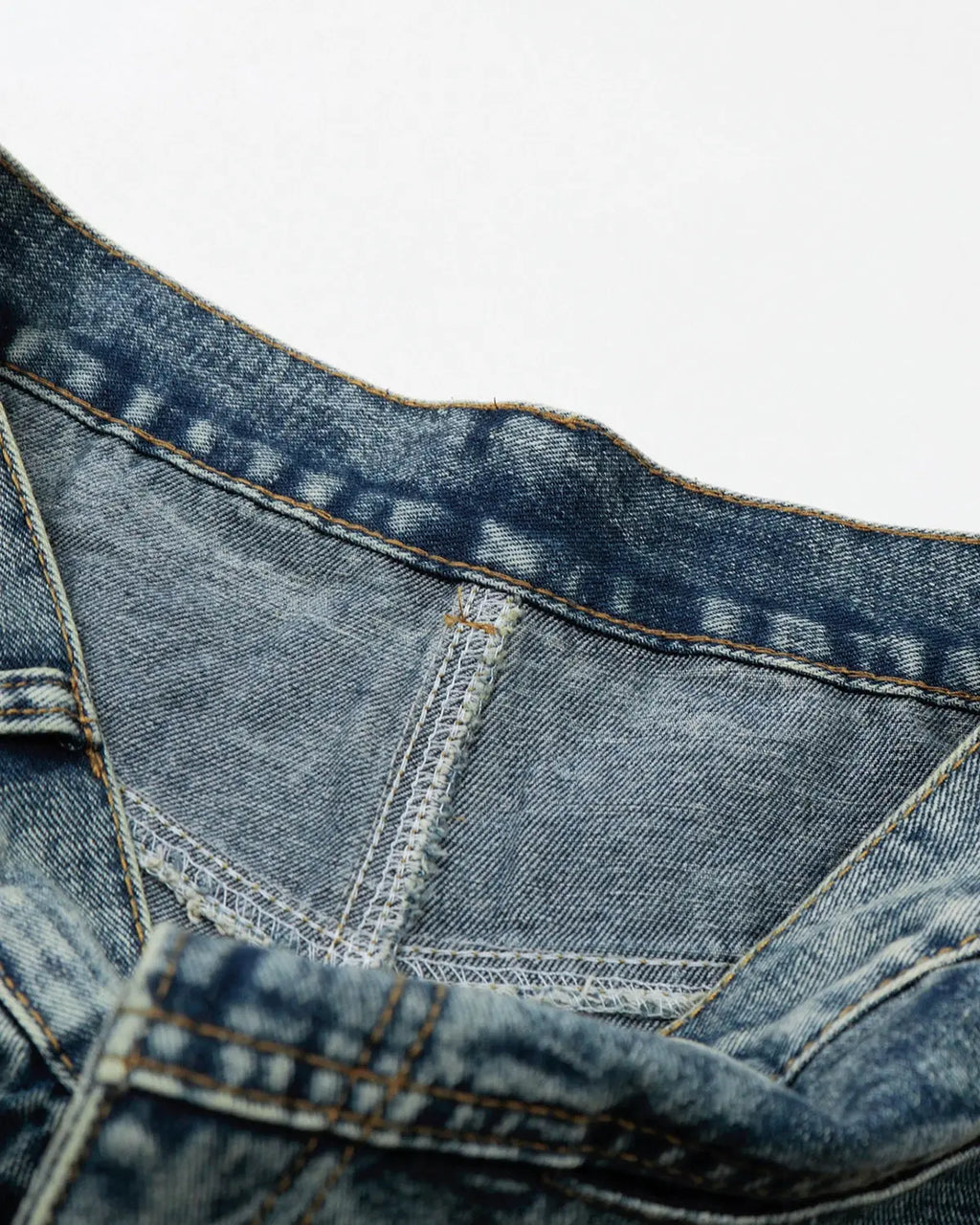 Blue studded washed long baggy jorts by Flation Streetwear, showing the relaxed fit and distressed denim design.