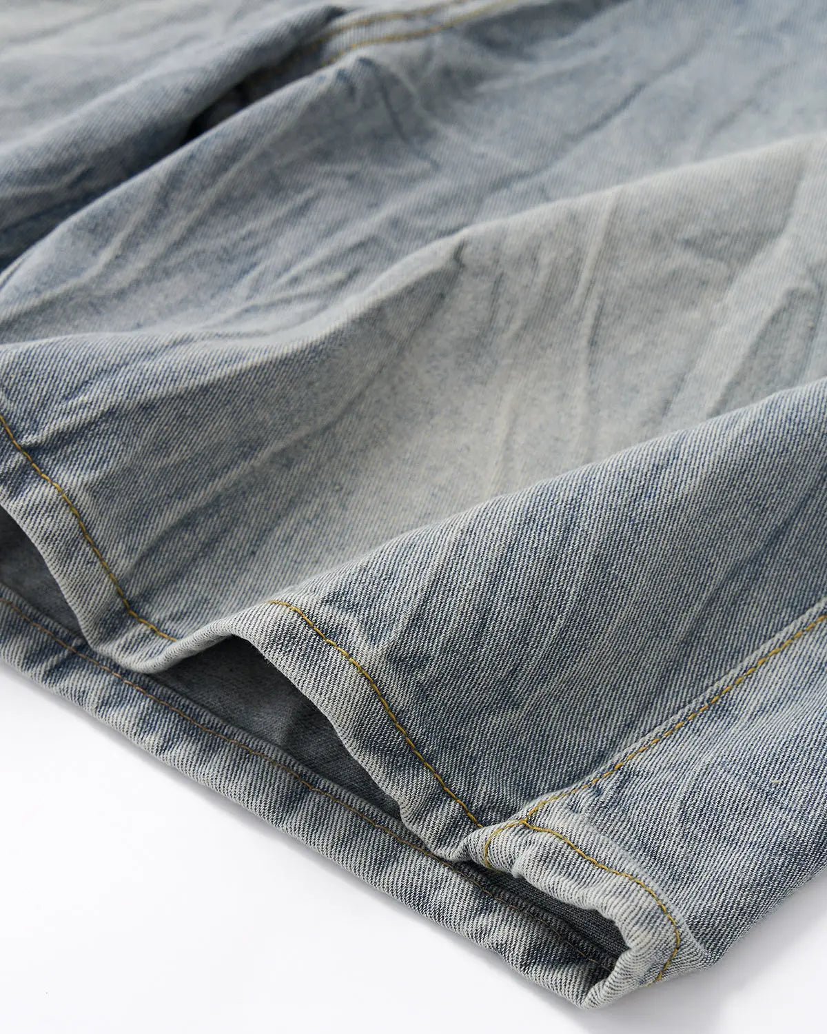 Blue textured washed longline jorts by Flation Streetwear, showcasing their relaxed fit and stylish distressed denim design.