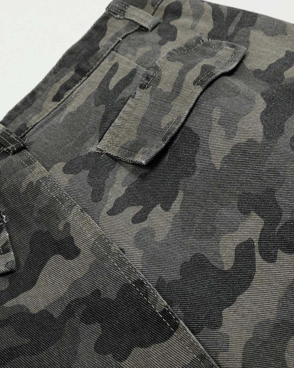 Embroidered camo cargo shorts by Flation Streetwear, featuring green and beige camouflage pattern with side pockets.