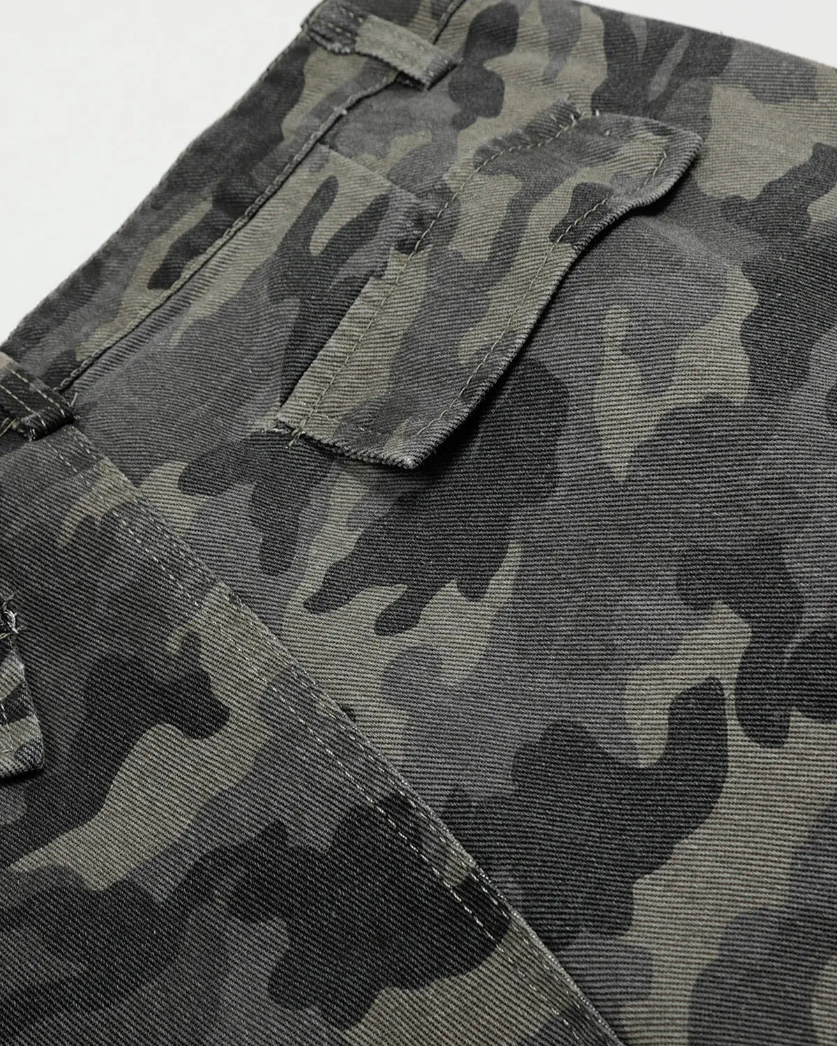 Embroidered camo cargo shorts by Flation Streetwear, featuring green and beige camouflage pattern with side pockets.