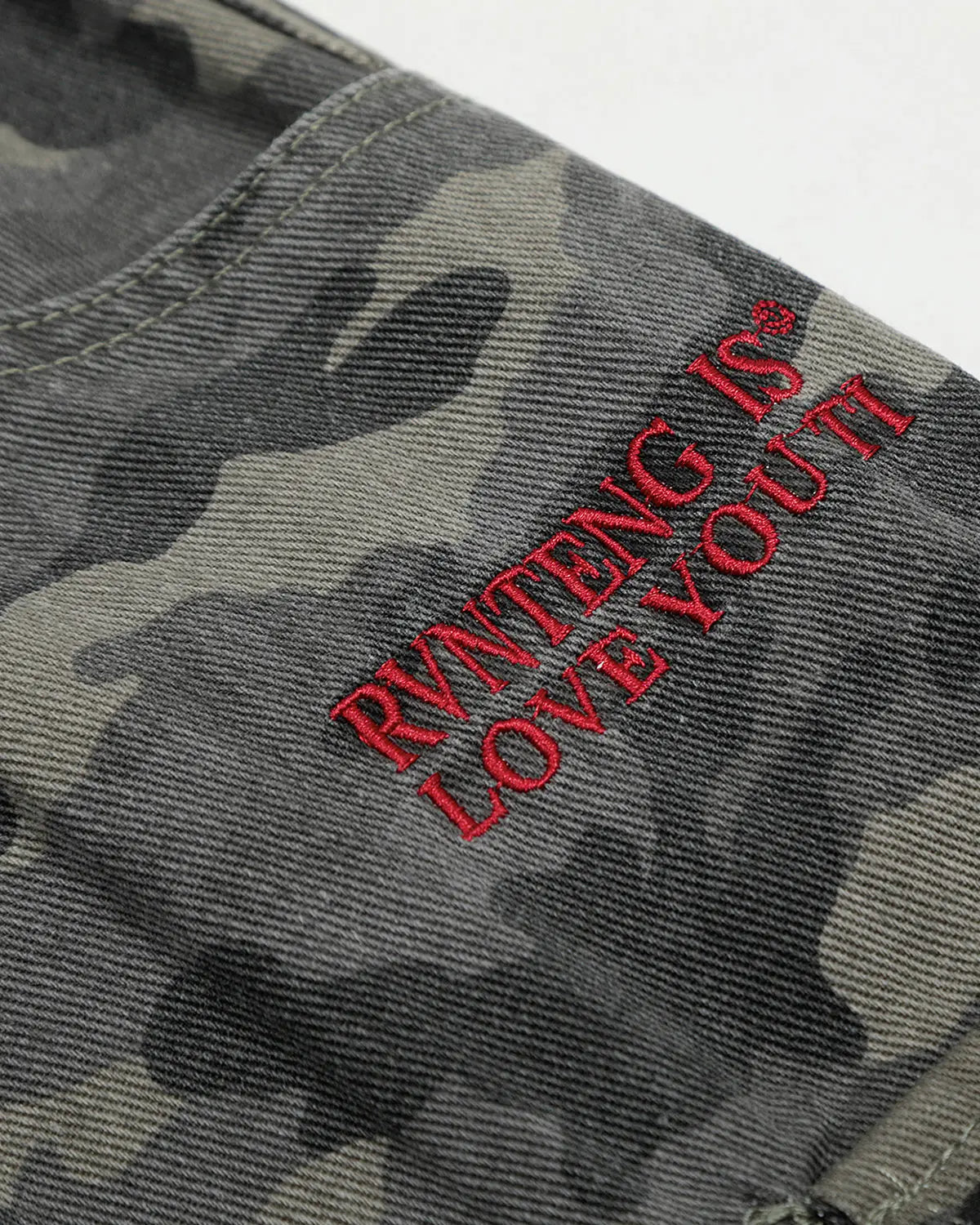 Embroidered camo cargo shorts by Flation Streetwear, featuring a relaxed fit and detailed embroidery on durable fabric.
