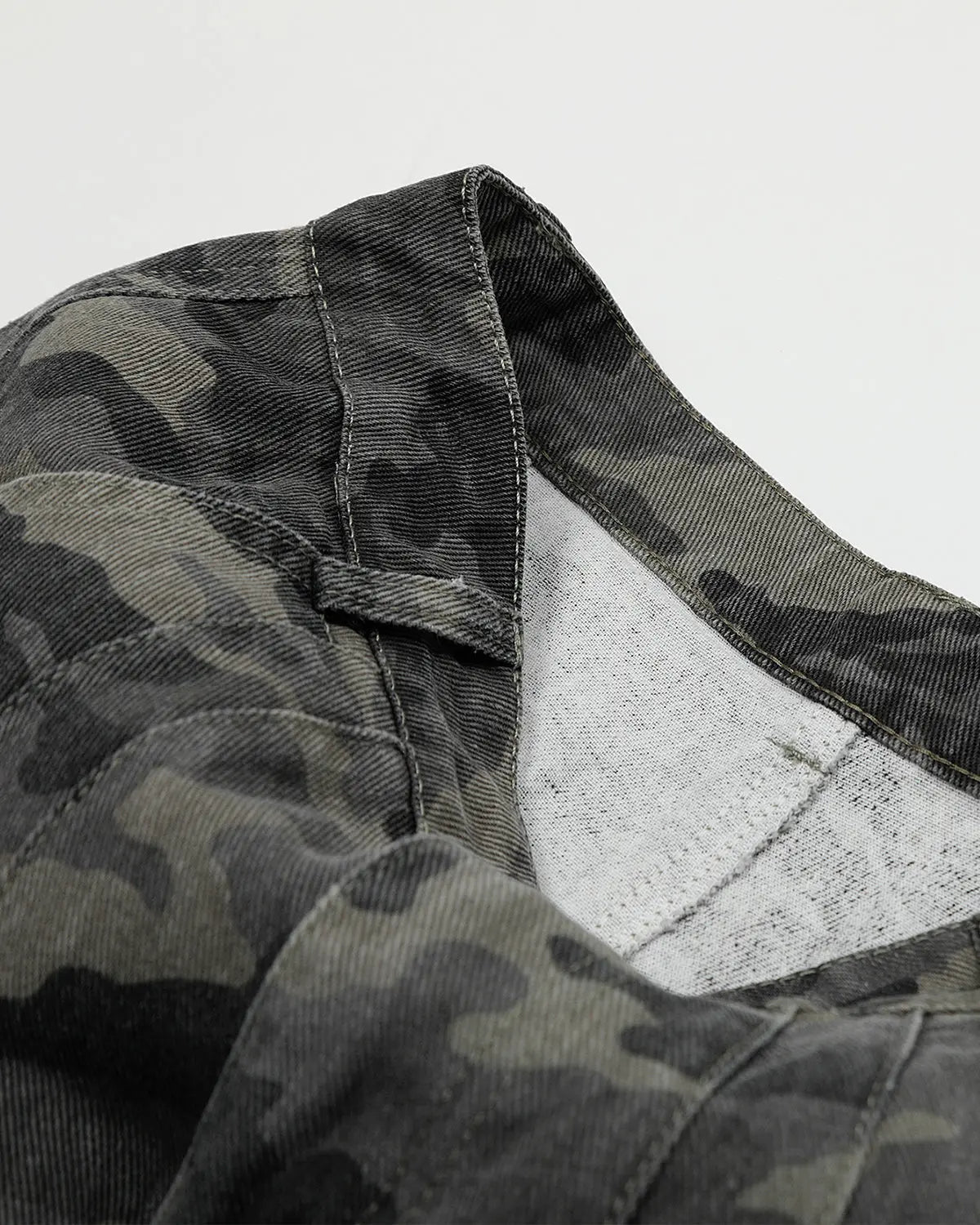 Embroidered camo cargo shorts by Flation Streetwear, featuring green camouflage pattern and multiple pockets, casual style.