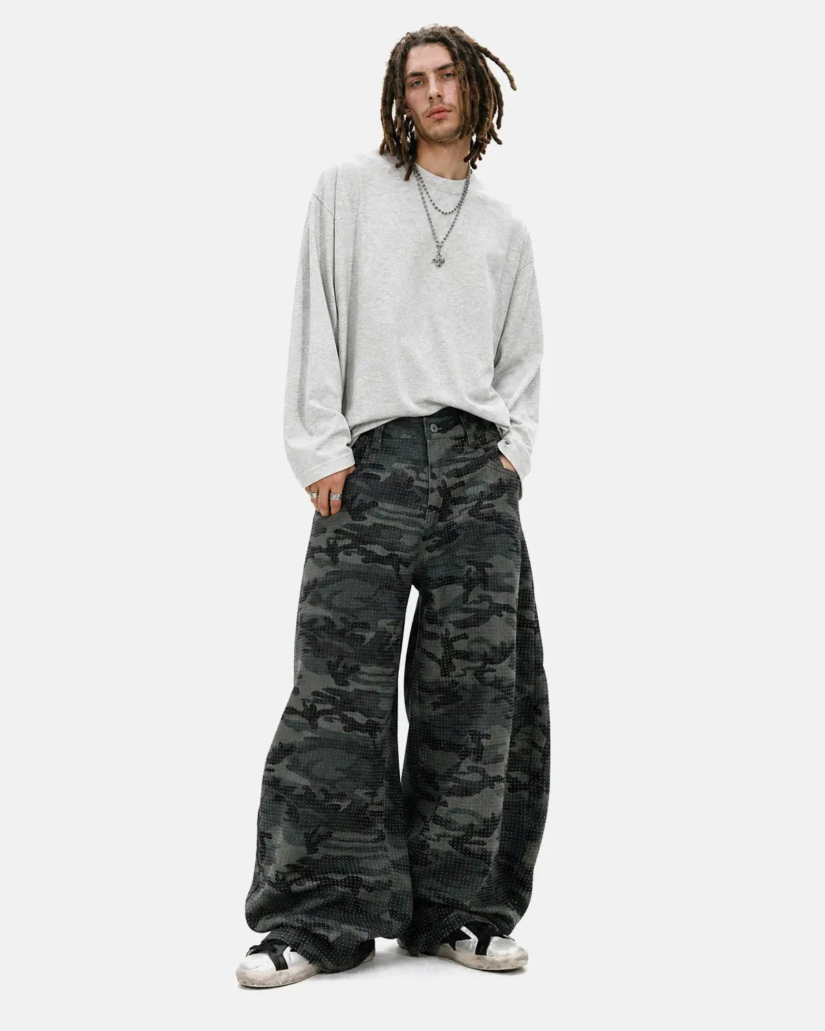 Inflation Streetwear rhinestone camo barrel pants with shiny embellishments and relaxed fit, shown on a model.