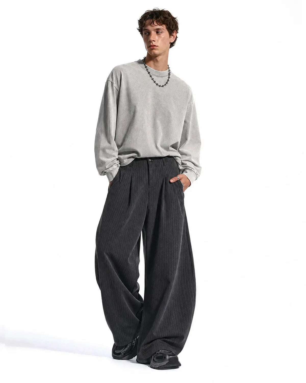 Flation pinstripe pleated barrel pants, tailored streetwear trousers with a high waist and relaxed fit, featuring vertical pinstripes.