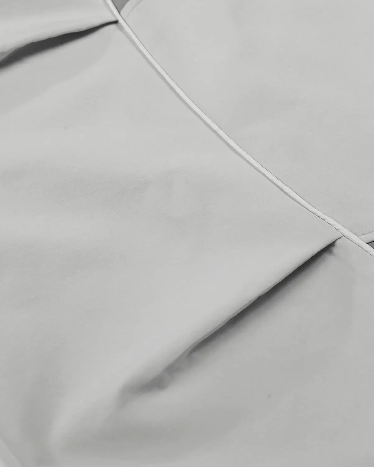 Grey Flation streetwear contrast panel baggy track pants with relaxed fit and sporty style, featuring bold panel design.