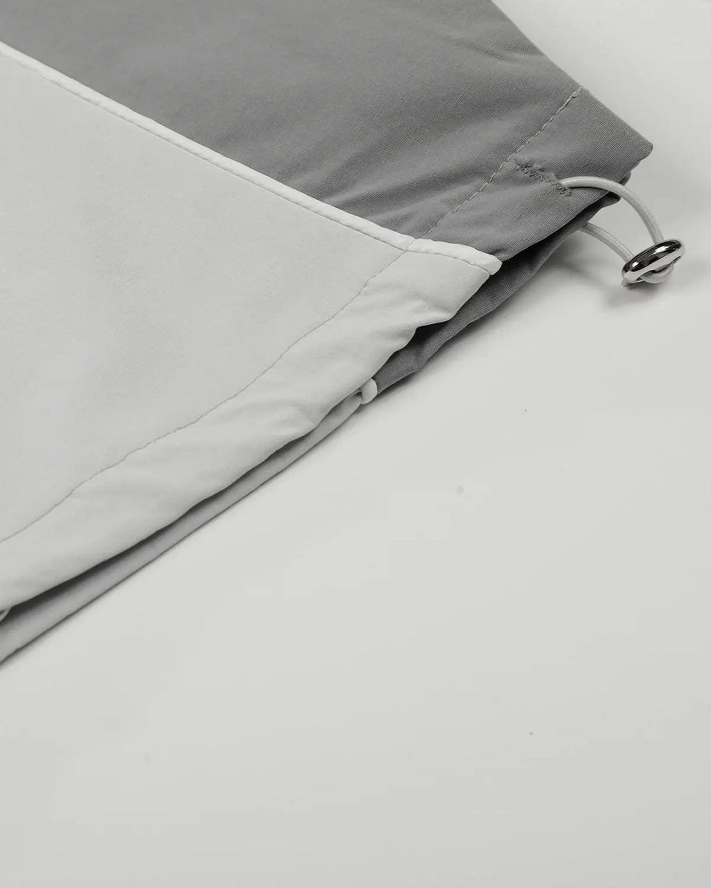 Grey Flation Streetwear contrast panel baggy track pants with relaxed fit and elastic waistband, featuring stylish panel details.