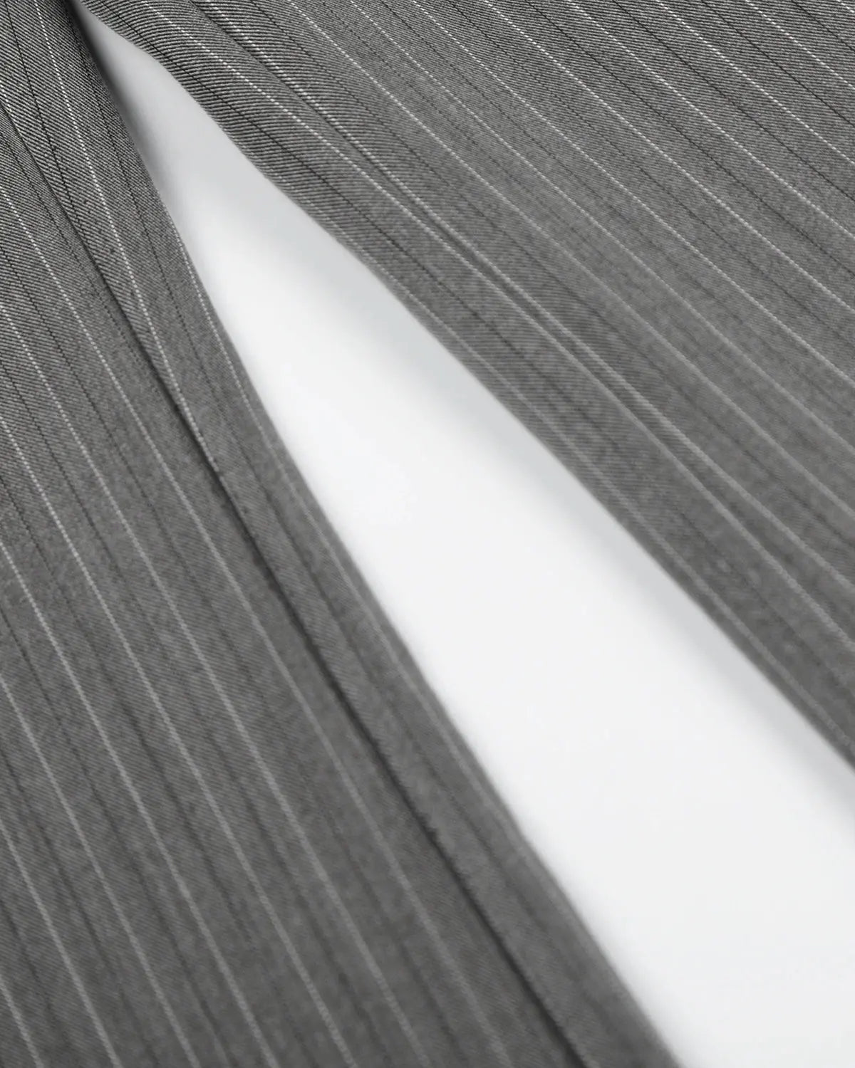Flation pinstripe cinch back tailored pants showing a sleek fit with a high waist and stylish pinstripe pattern.