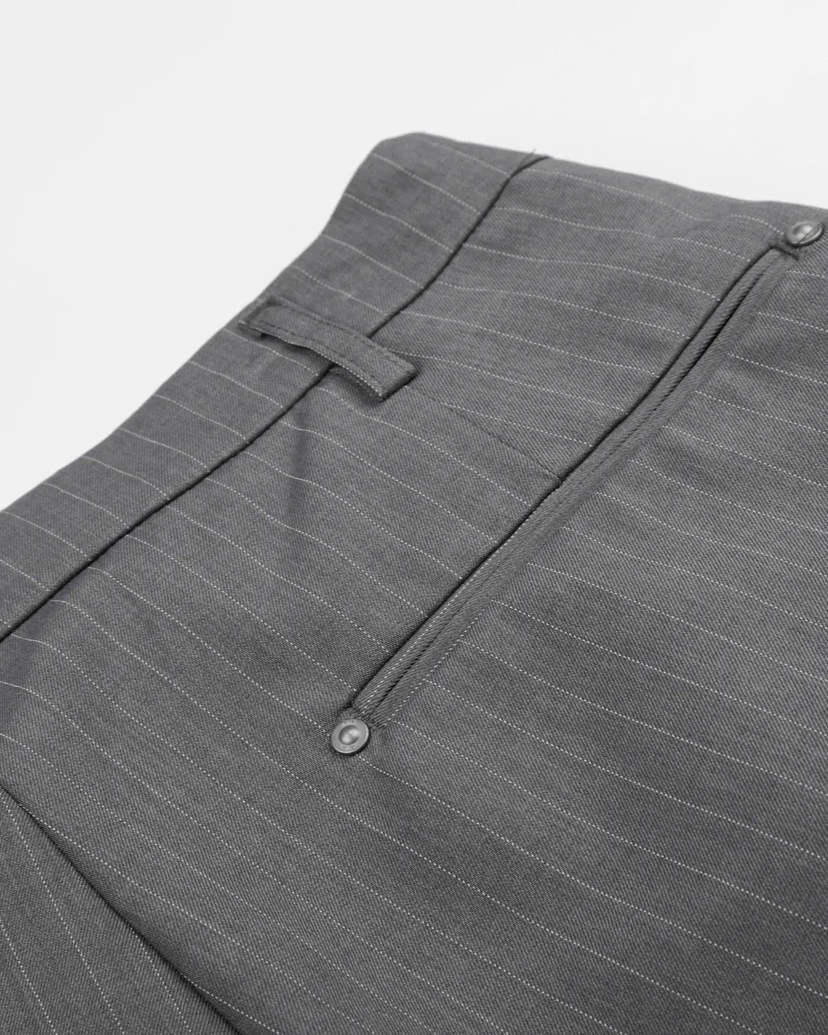 Flation pinstripe pleated tailored shorts with ring detail, featuring a stylish, structured design and high-waisted fit.