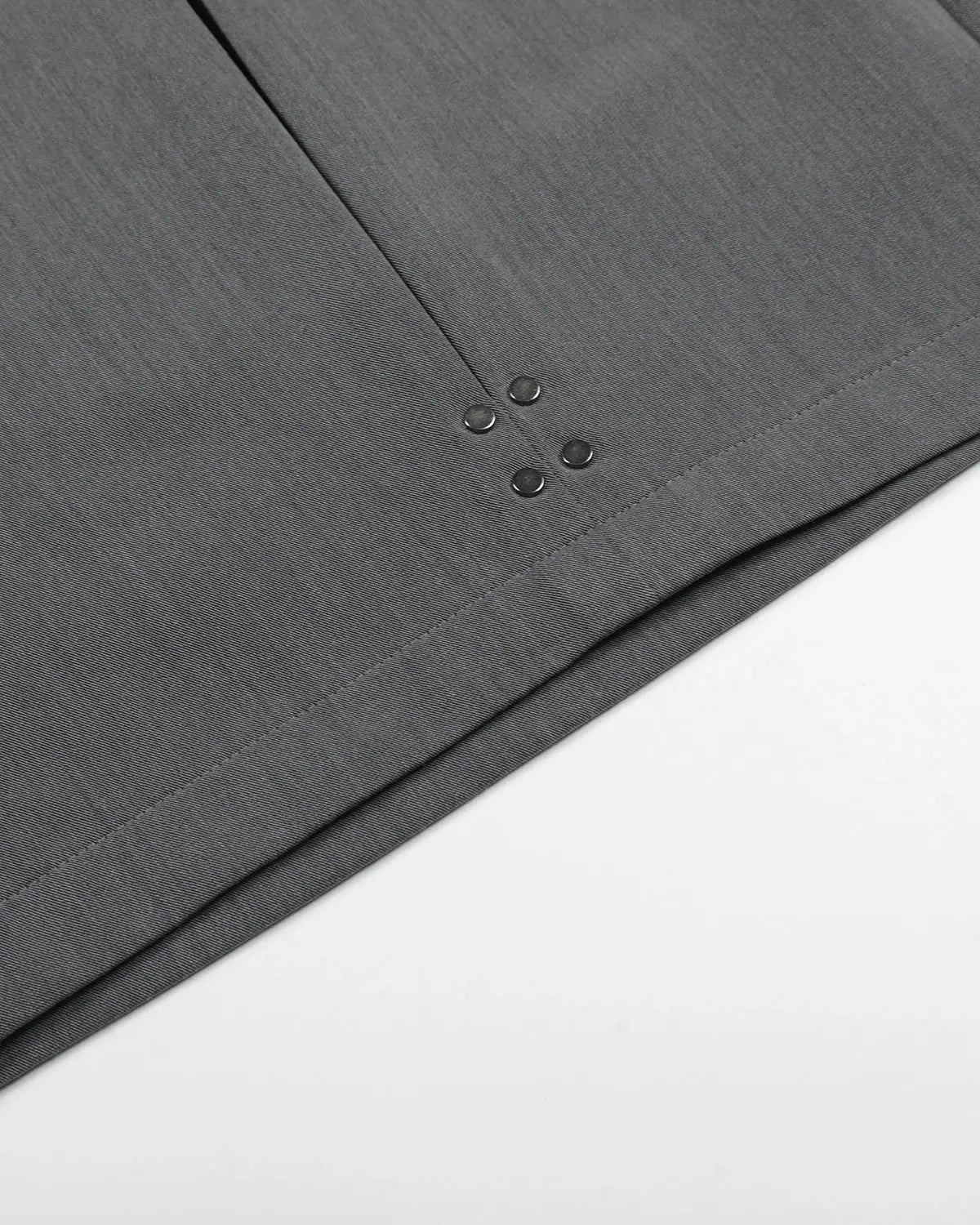 Inflation brand pleated stud detail tailored shorts, stylish pants with a structured fit and metal stud accents, black fabric.