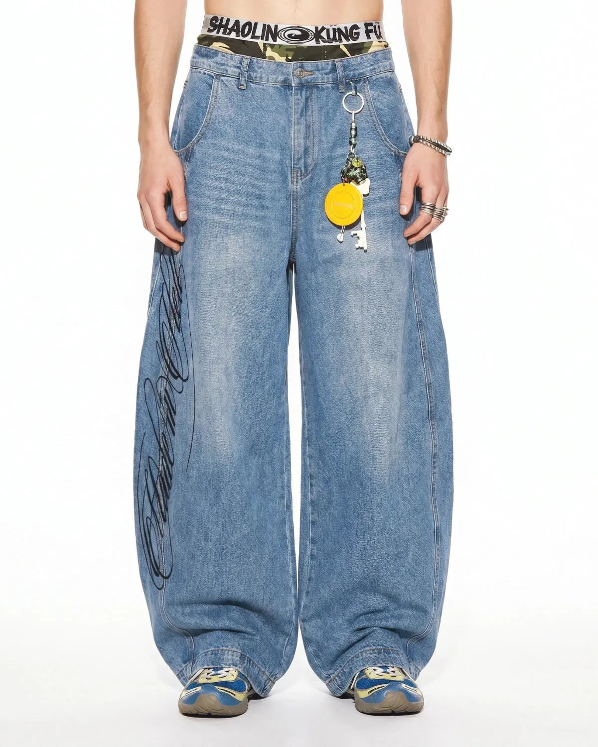 Inflation Script Graphic Barrel Jeans showing baggy fit and bold script logo on navy blue denim pants.