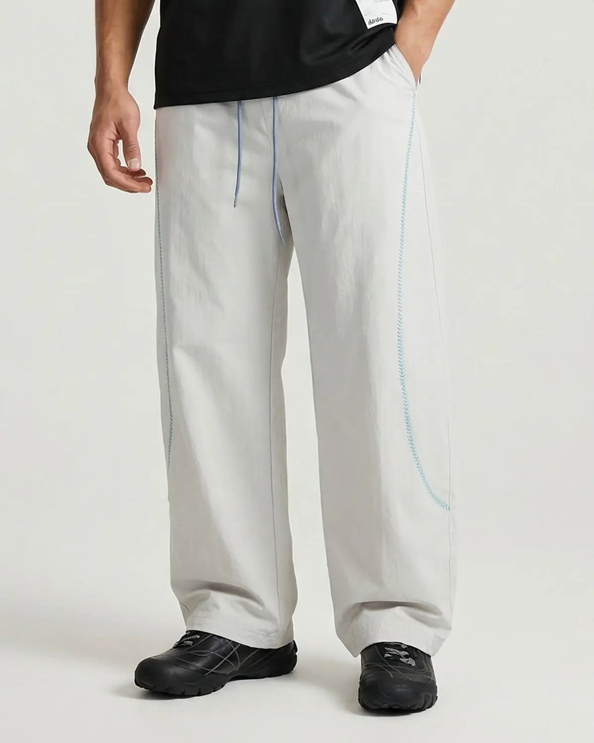Light grey Flation AirFlow Contrast Embroidered Track Pants made with Flation TECHLATION™ fabric, featuring stylish embroidery and comfortable fit.