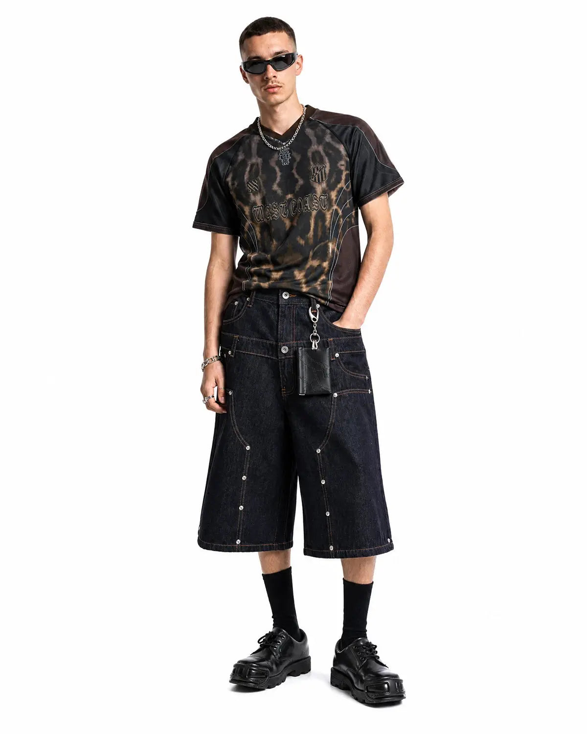 Blue double waist rivet baggy jorts by Flation, streetwear denim pants with distressed details and relaxed fit.