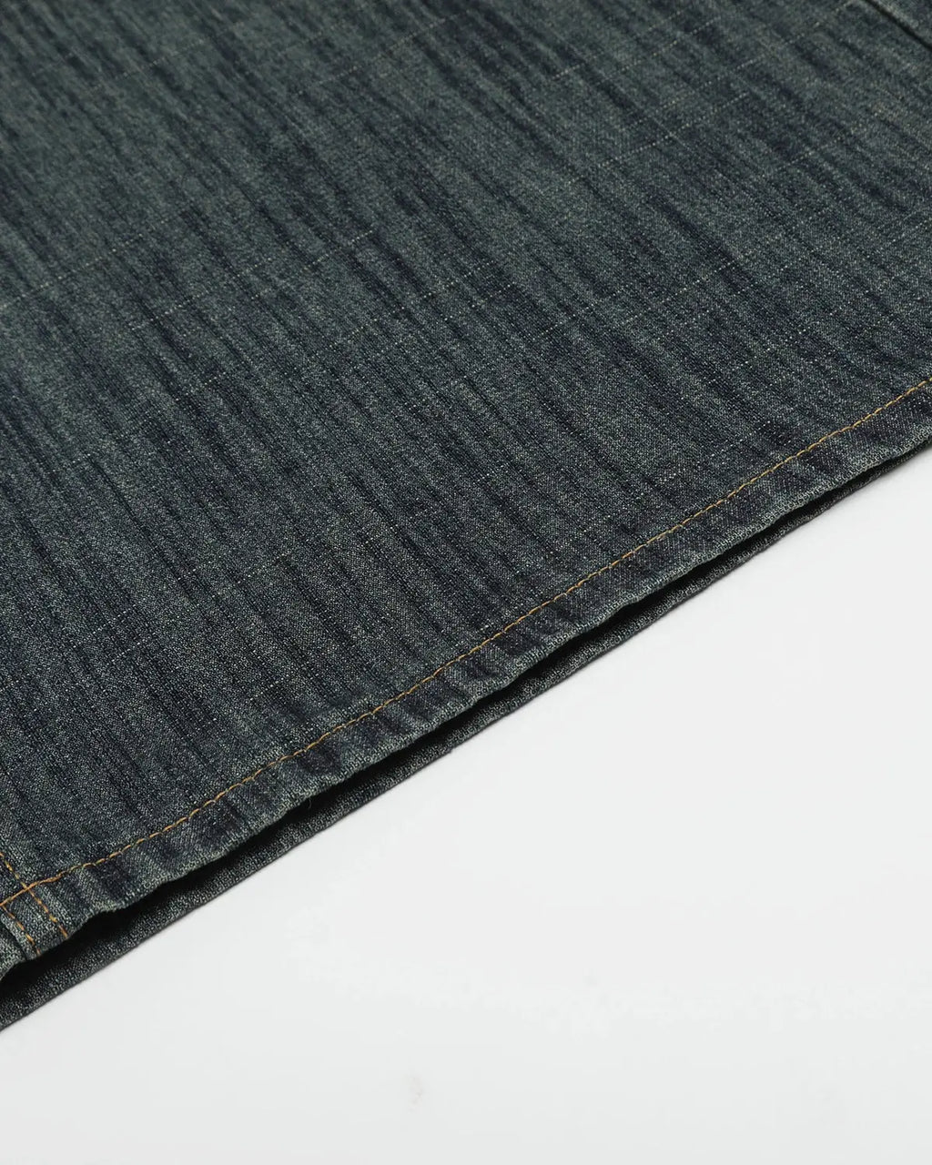Raw wide-leg long jorts by Flation Streetwear featuring distressed denim and casual fit, styled with rolled-up cuffs.