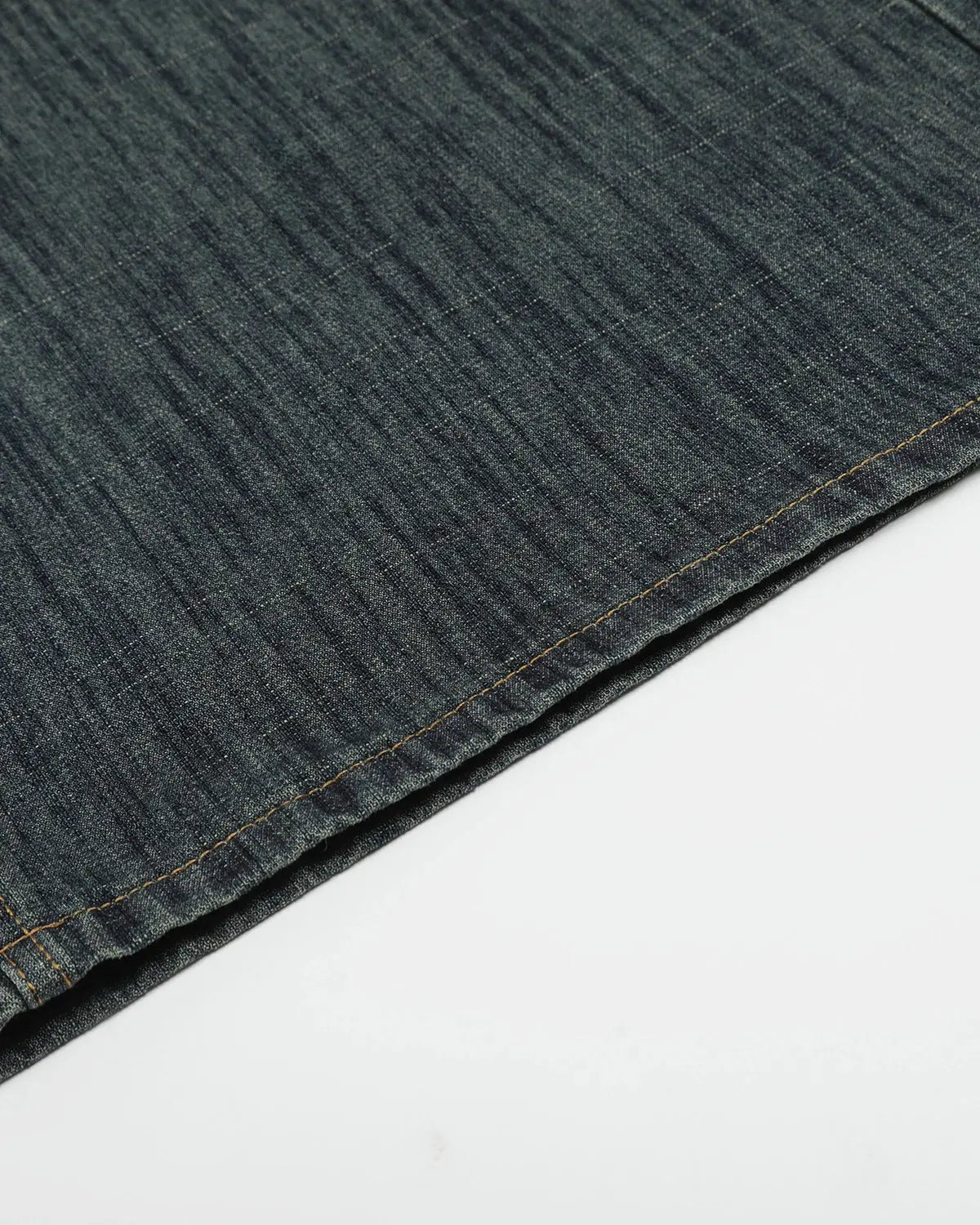 Raw wide-leg long jorts by Flation Streetwear featuring distressed denim and casual fit, styled with rolled-up cuffs.