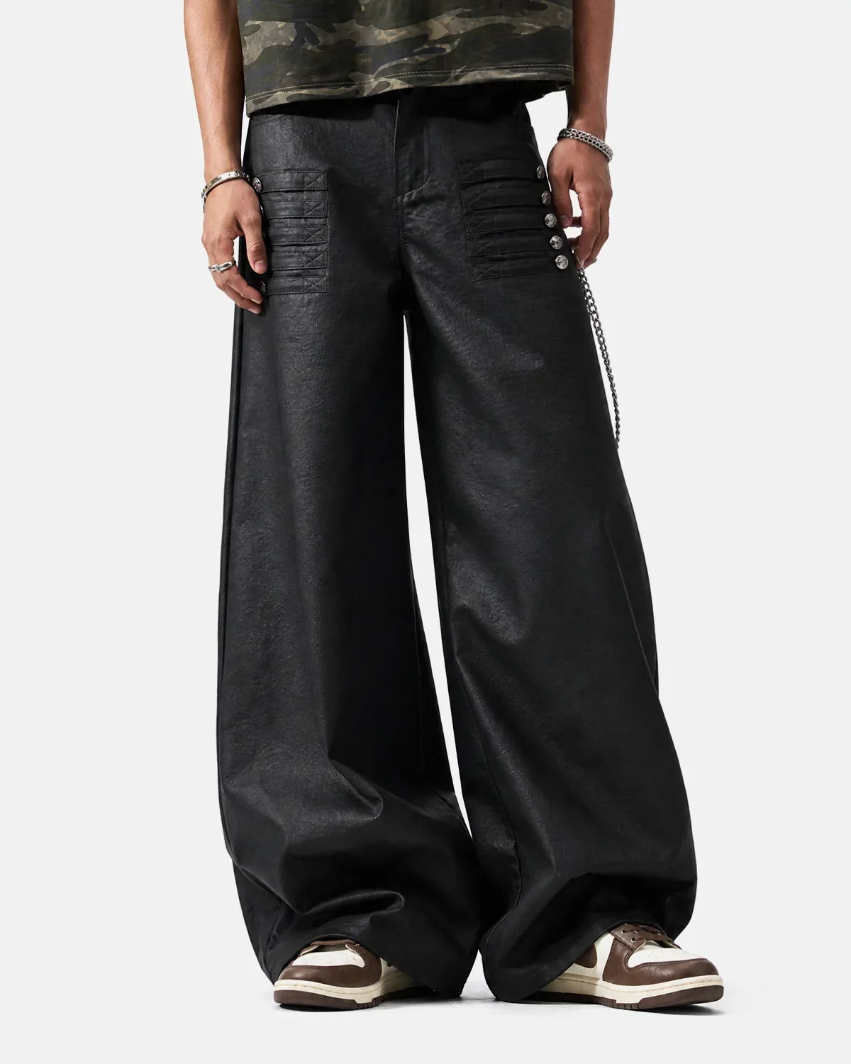 Black graphic wide-leg pants by Flation streetwear, showcasing a relaxed fit with bold graphic details and wide leg silhouette.