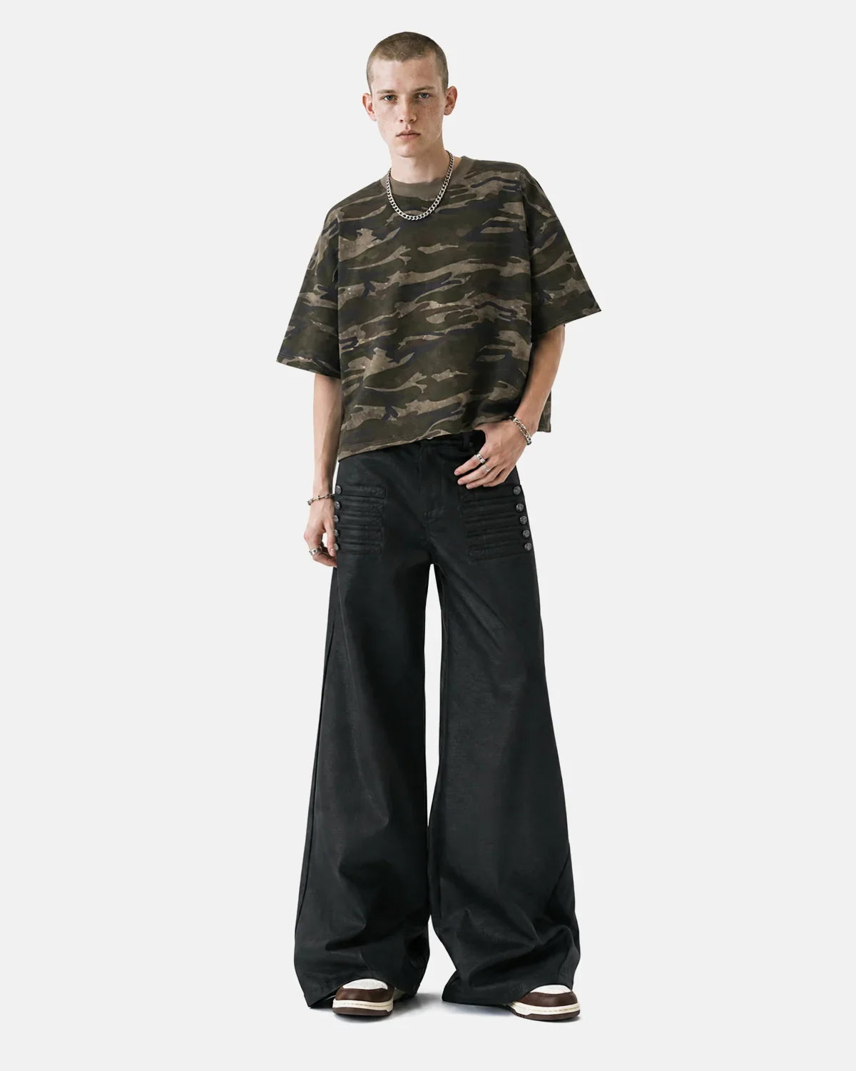 Black graphic wide-leg pants by Flation Streetwear featuring bold graphic designs and a relaxed fit style.