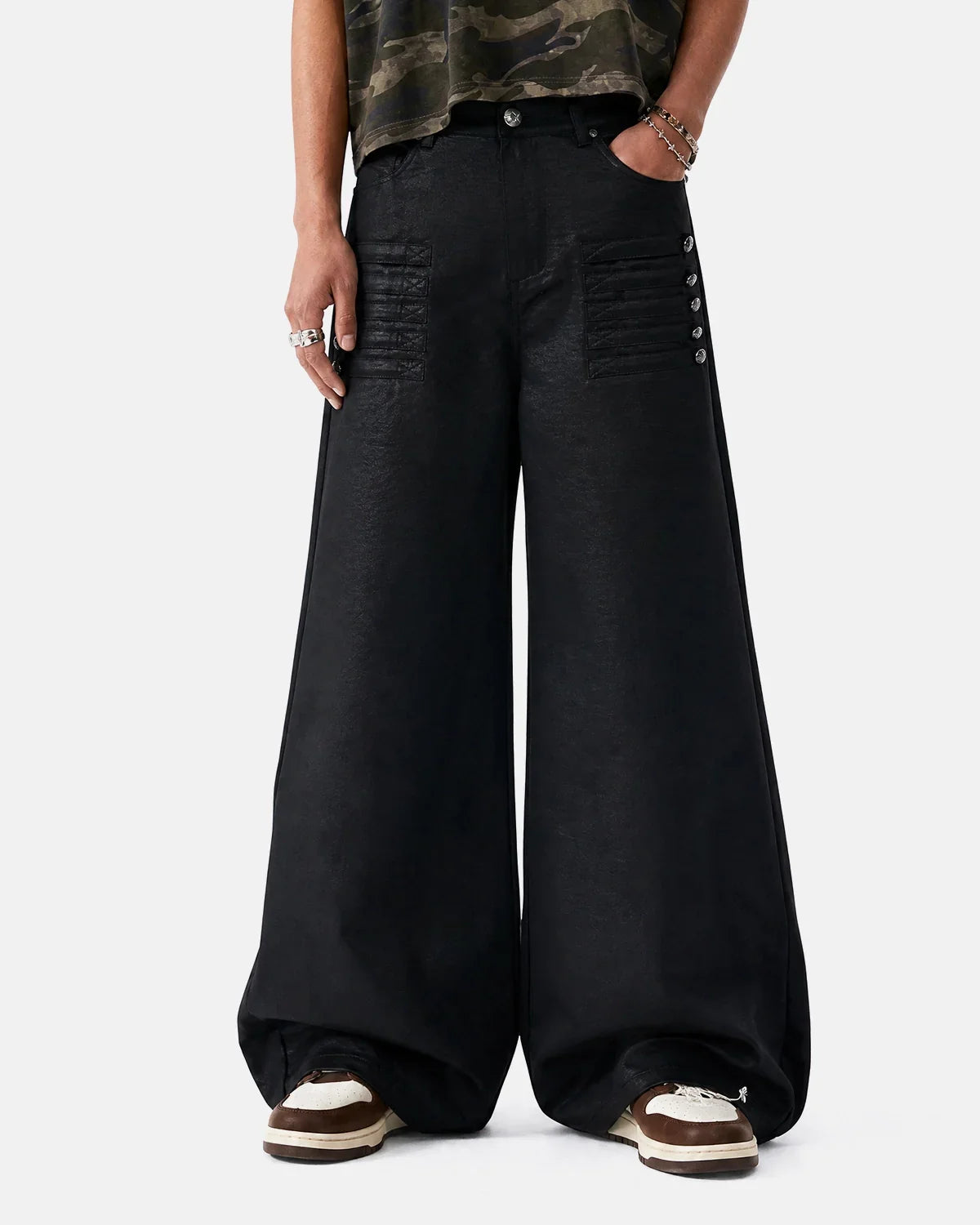 Black graphic wide-leg pants by Flation Streetwear, featuring bold design and relaxed fit, shown on a model.