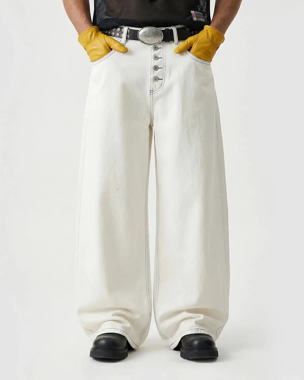 White Flation streetwear baggy jeans with contrast stitching, relaxed fit pants featuring trendy design details.