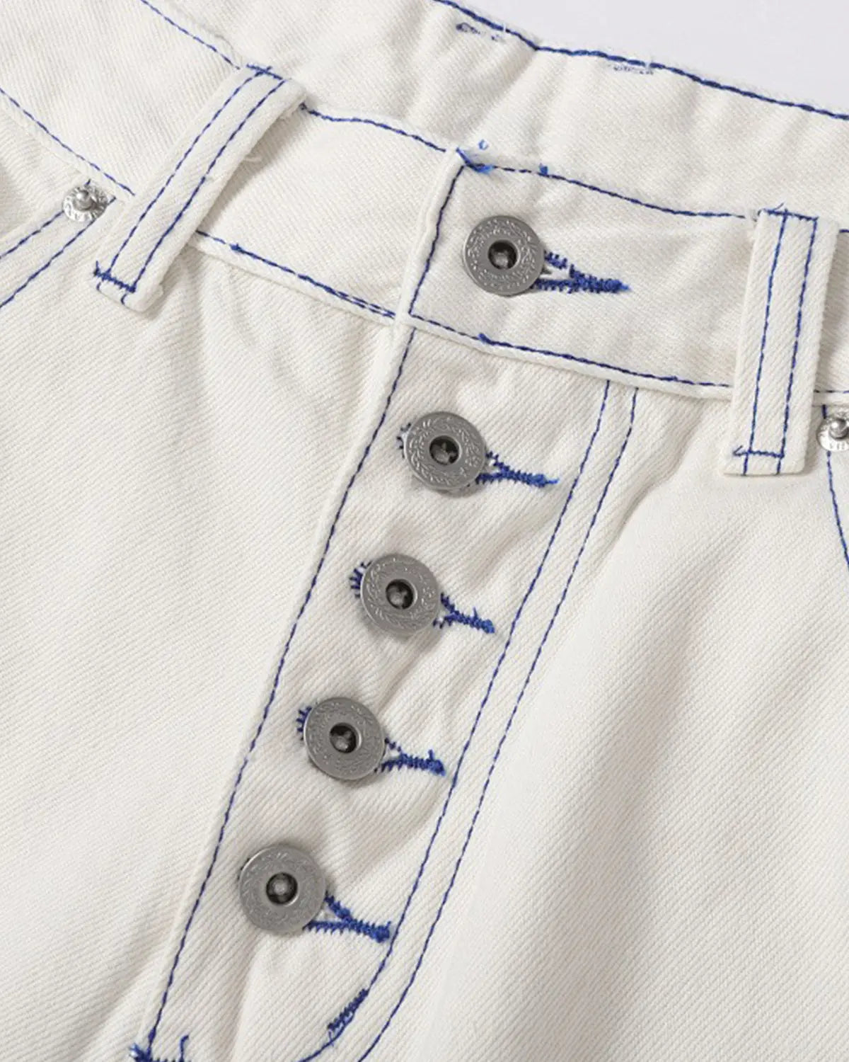 White contrast stitch baggy jeans by Flation Streetwear, featuring relaxed fit and casual streetwear style.