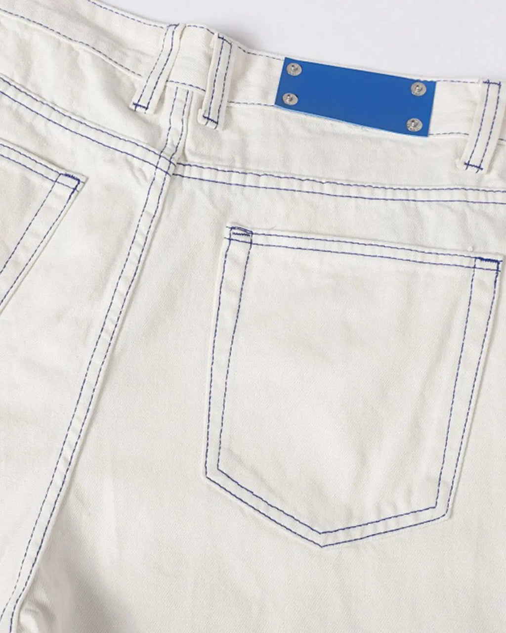 White Flation Streetwear baggy jeans with contrast stitching, relaxed fit pants with stylish oversized design.