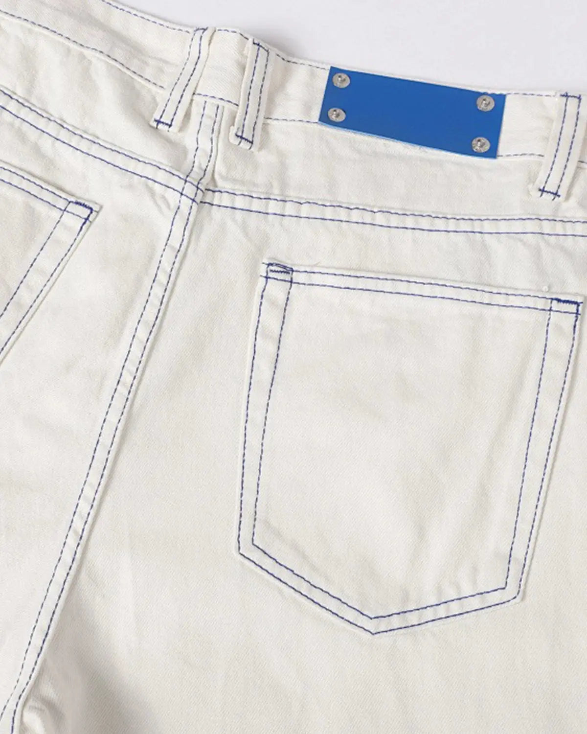 White Flation Streetwear baggy jeans with contrast stitching, relaxed fit pants with stylish oversized design.