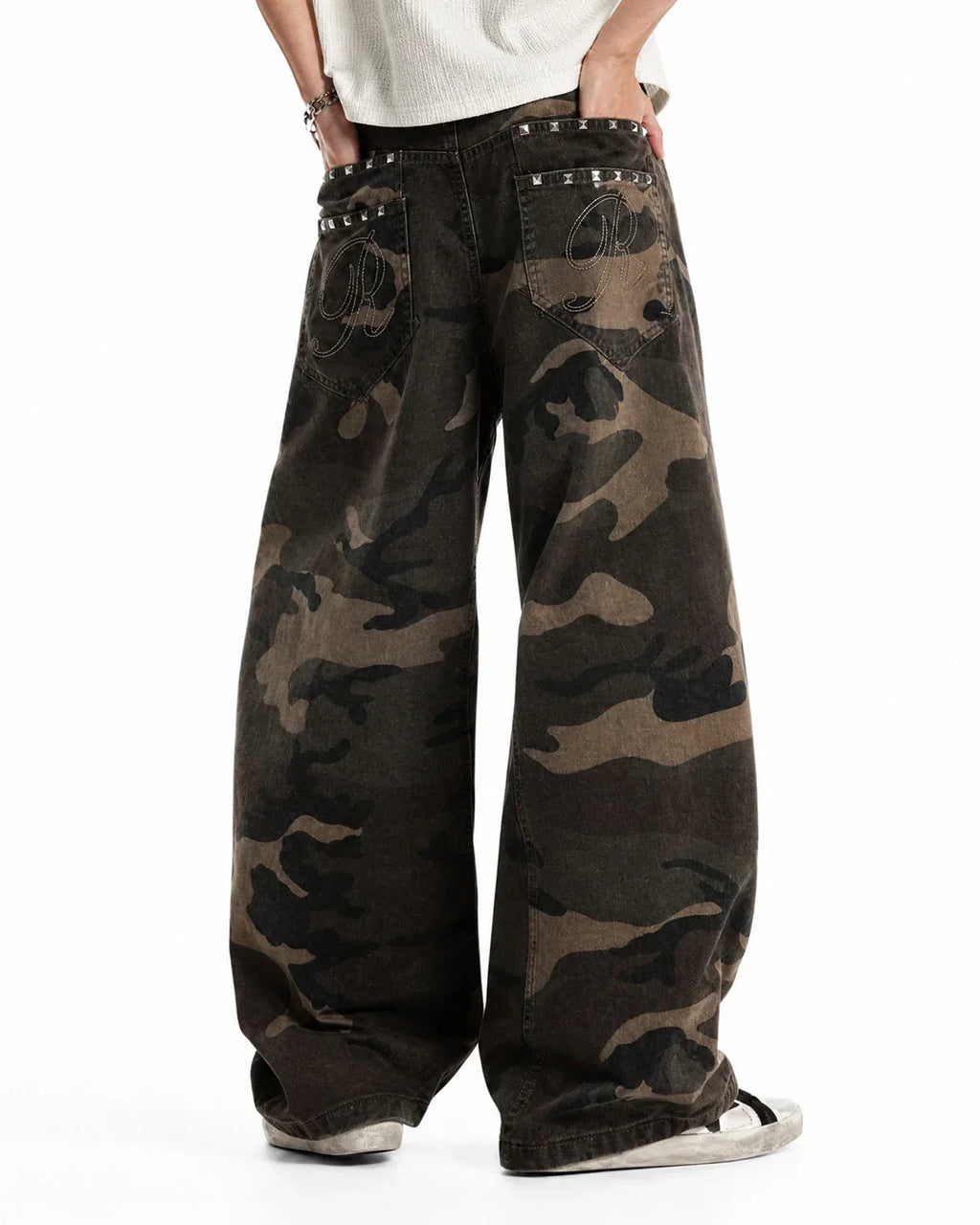 Flation studded camo barrel jeans, stylish streetwear pants with metal stud accents and camouflage pattern, casual urban fashion.