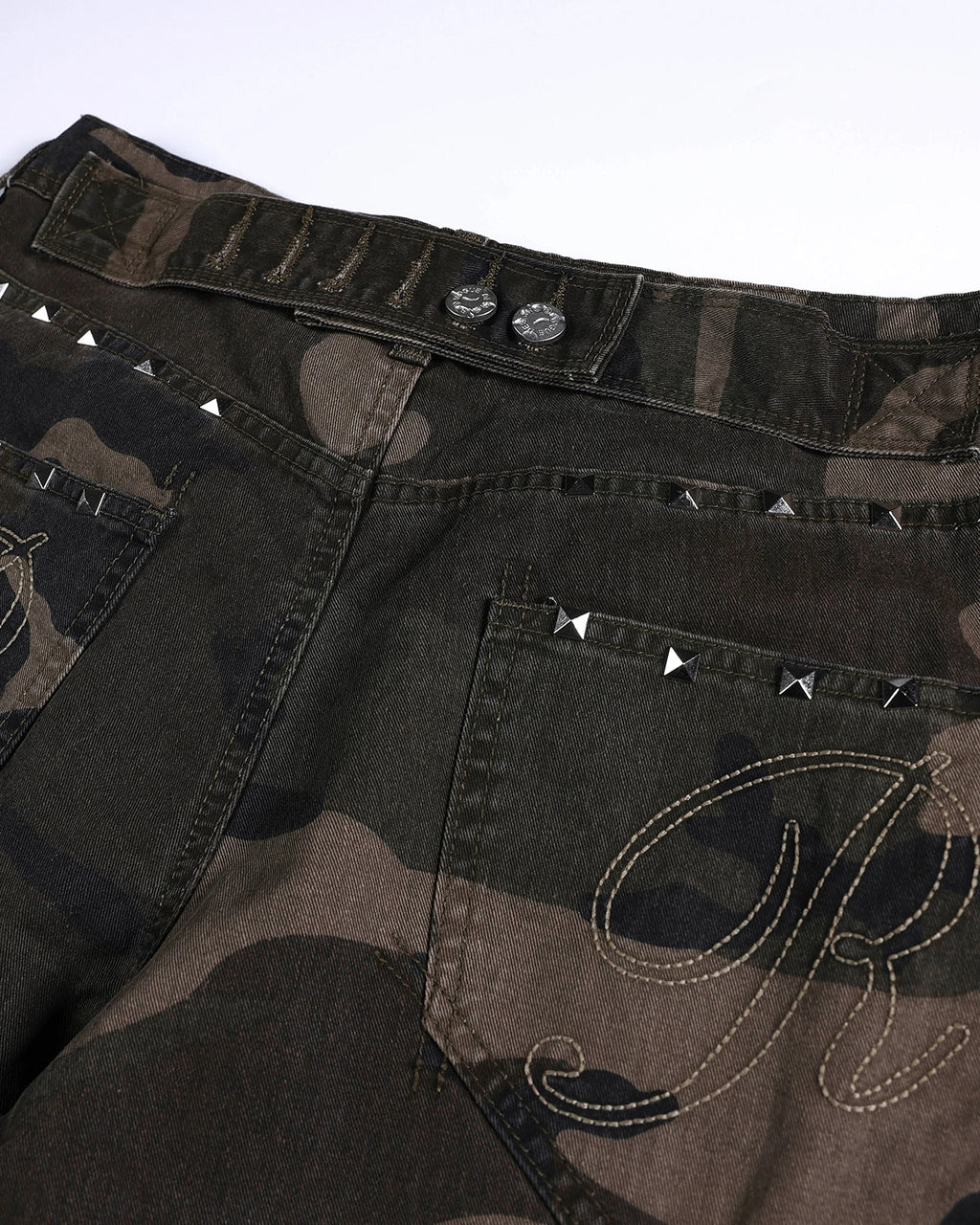 Flation Studded Camo Barrel Jeans displaying distressed denim with metal studs and a relaxed fit, streetwear style.