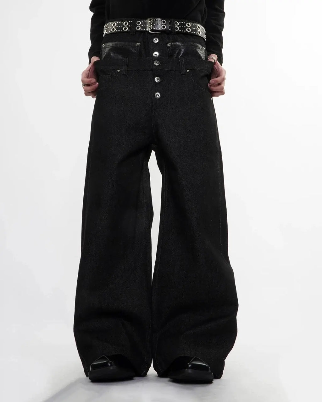 Black Flation streetwear double-wasit raw super baggy jeans with a relaxed fit and distressed details, styled on a model.