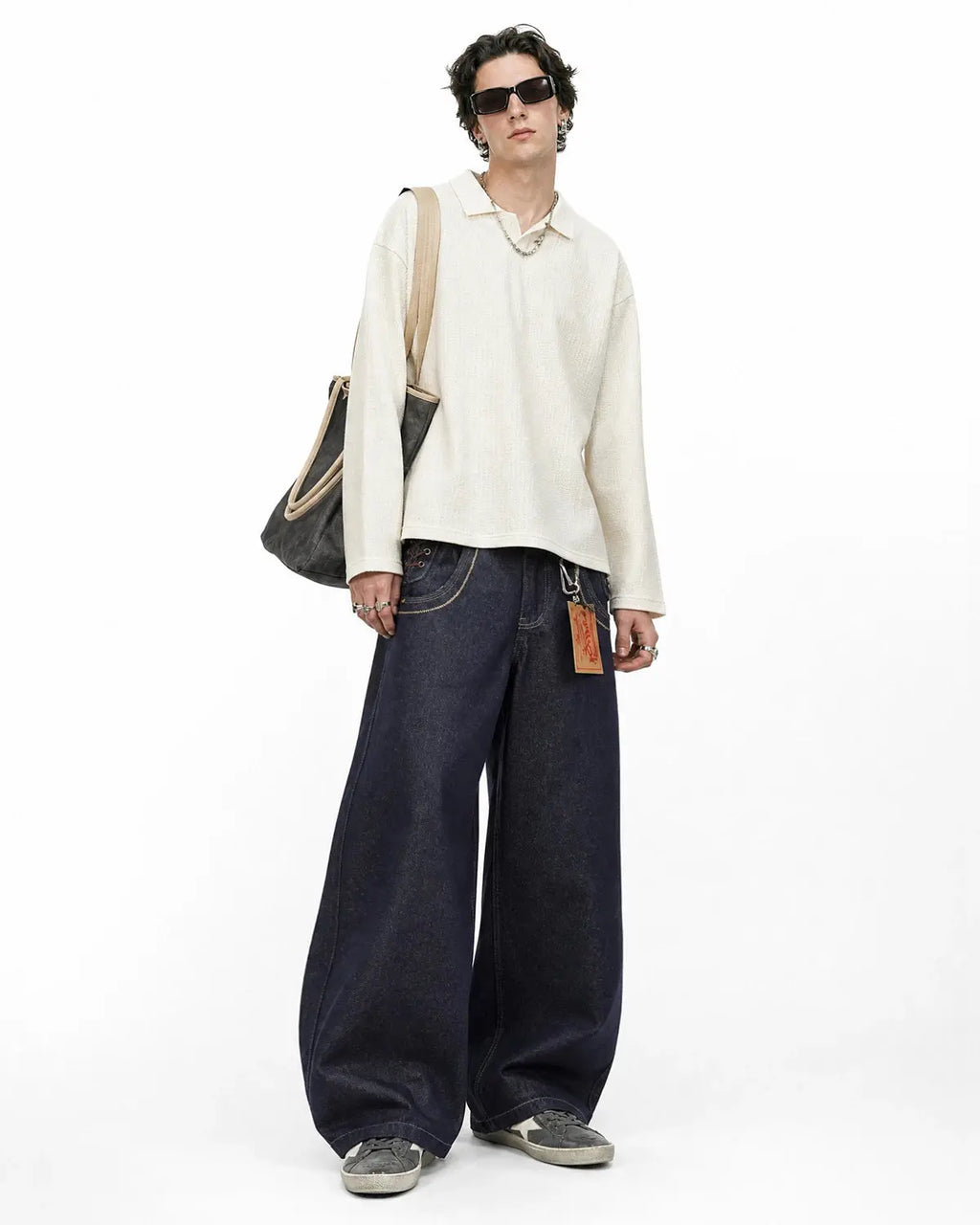 Black side lace-up raw baggy jeans by Flation Streetwear, featuring a relaxed fit and raw denim details.