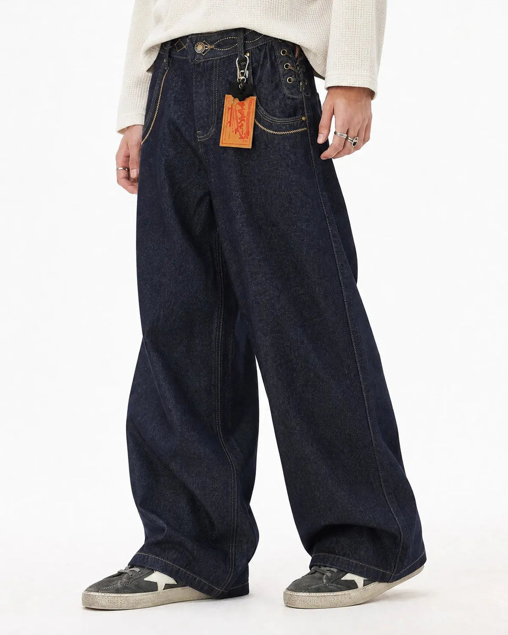 Black Flation Side Lace-Up Raw Baggy Jeans with raw hem and relaxed fit, featuring side lace-up detailing for streetwear style.