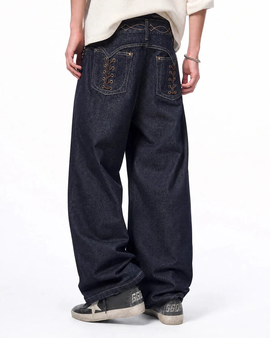 Black Flation Streetwear side lace-up raw baggy jeans featuring a relaxed fit and distressed detailing.